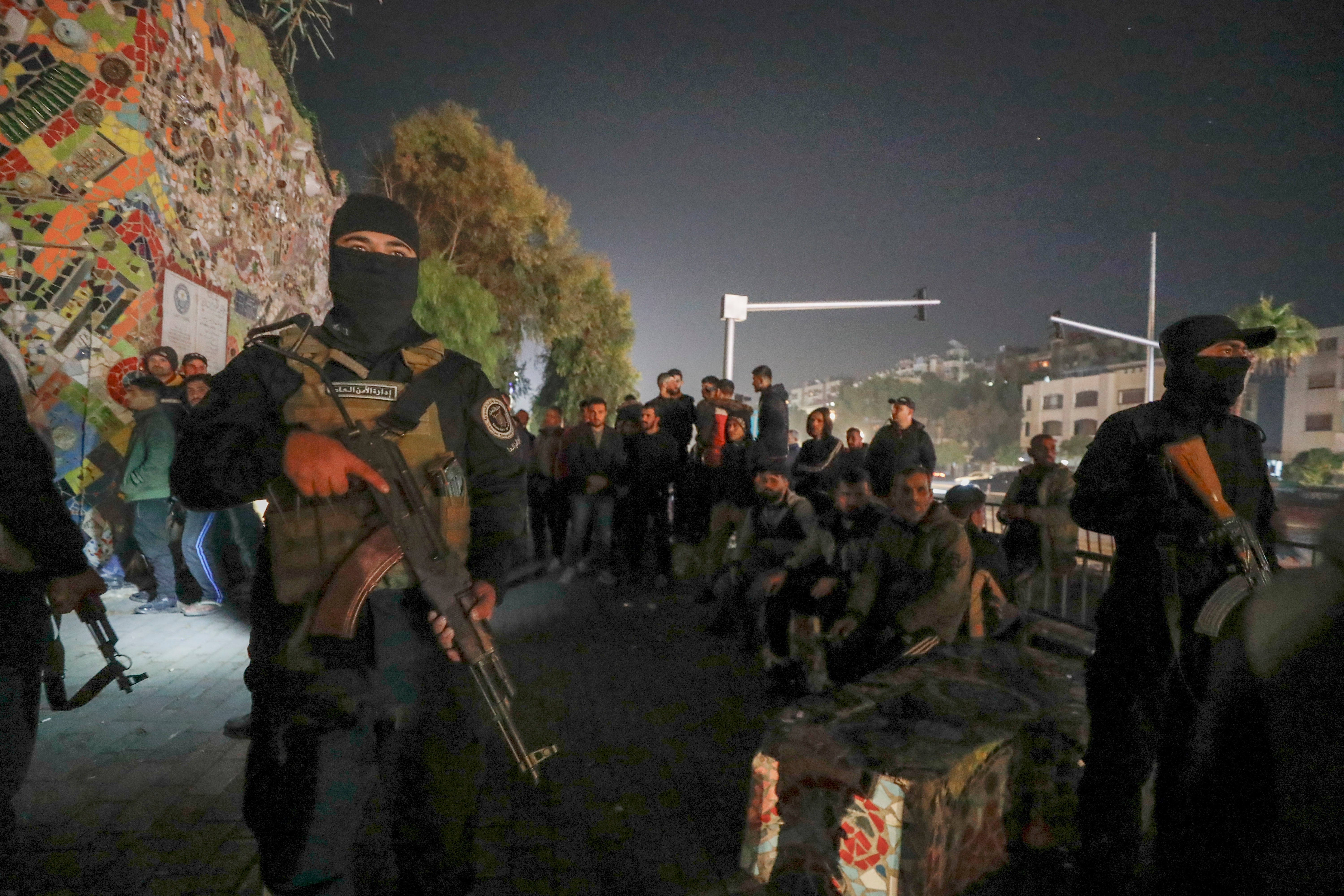 <p>Security forces of the new Syrian regime secure area around Alawite protesters in Mazzeh, Damascus </p>