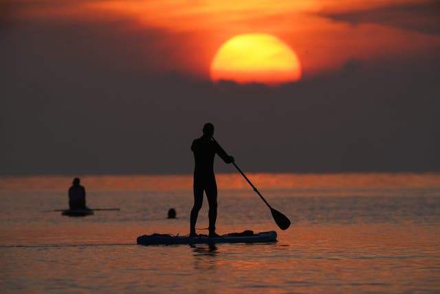 Paddleboarders on the North Sea at Cullercoats Bay in North Tyneside, as the first day of Meteorological Autumn -September 1 – approaches (Owen Humphreys/PA)