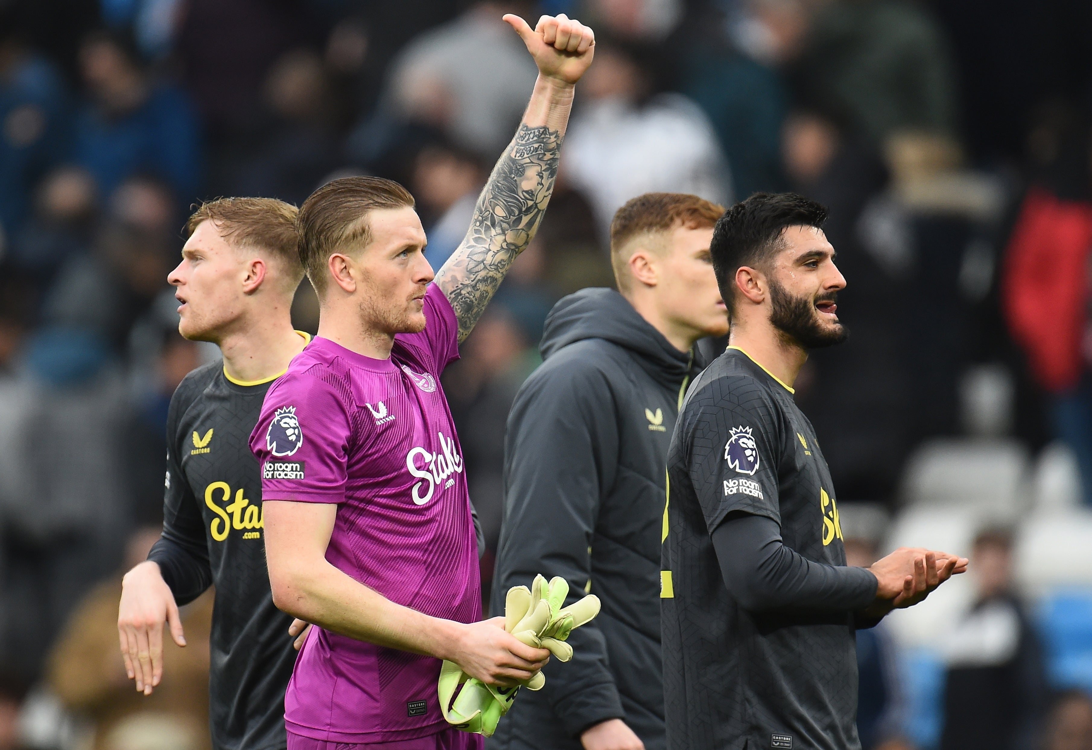 Jordan Pickford salutes the travelling fans at full-time