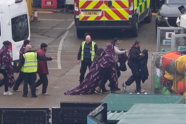 A group of people thought to be migrants are brought in to Dover (Gareth Fuller/PA)