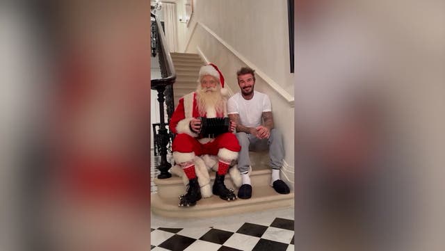 <p>David Beckham sings Christmas classic with Santa as daughter Harper watches on.</p>