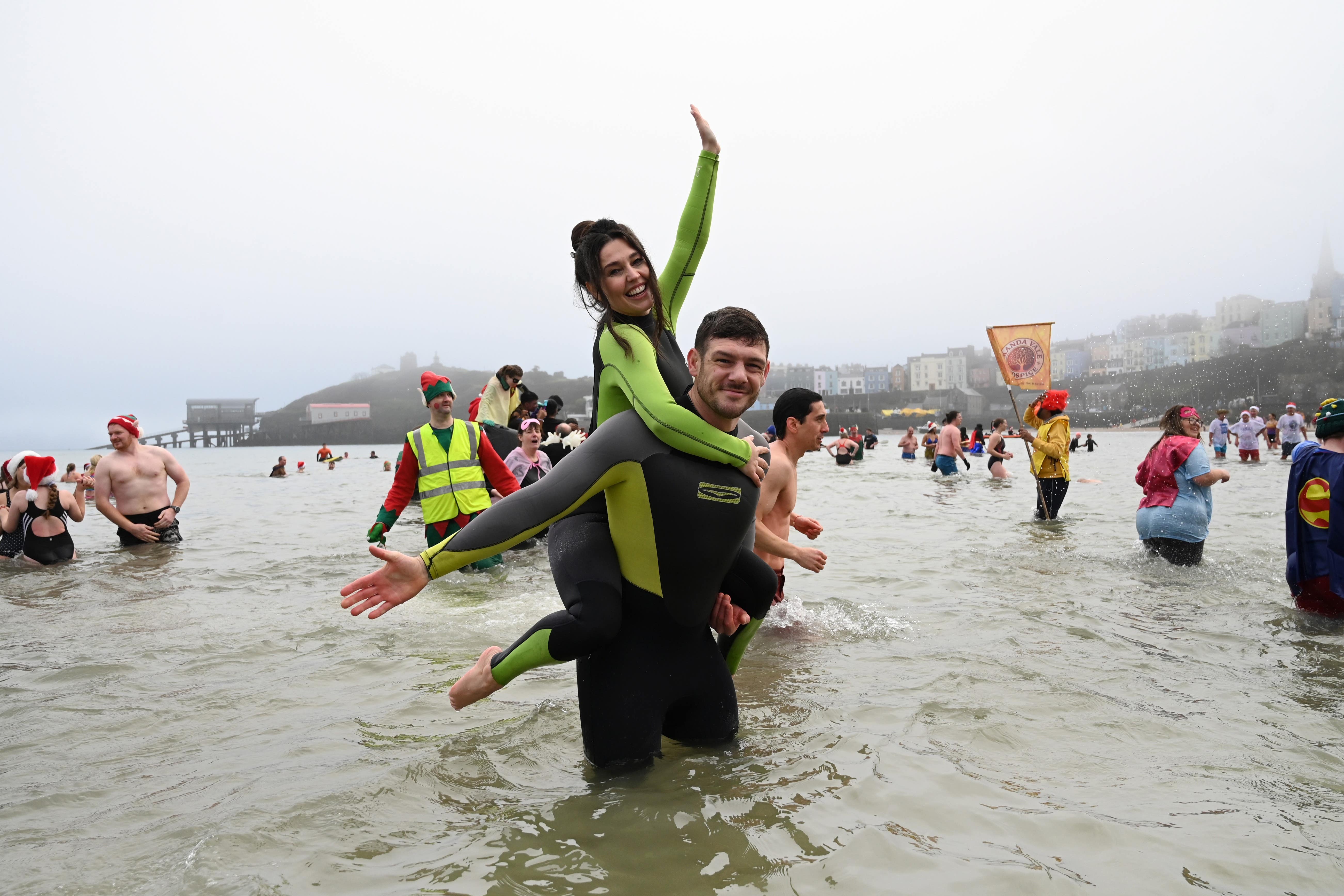 Philip Frith proposed to Victoria Tansey at the Boxing Day Tenby swim (Gareth Davies Photography/Tenby Boxing Day Swim/PA)