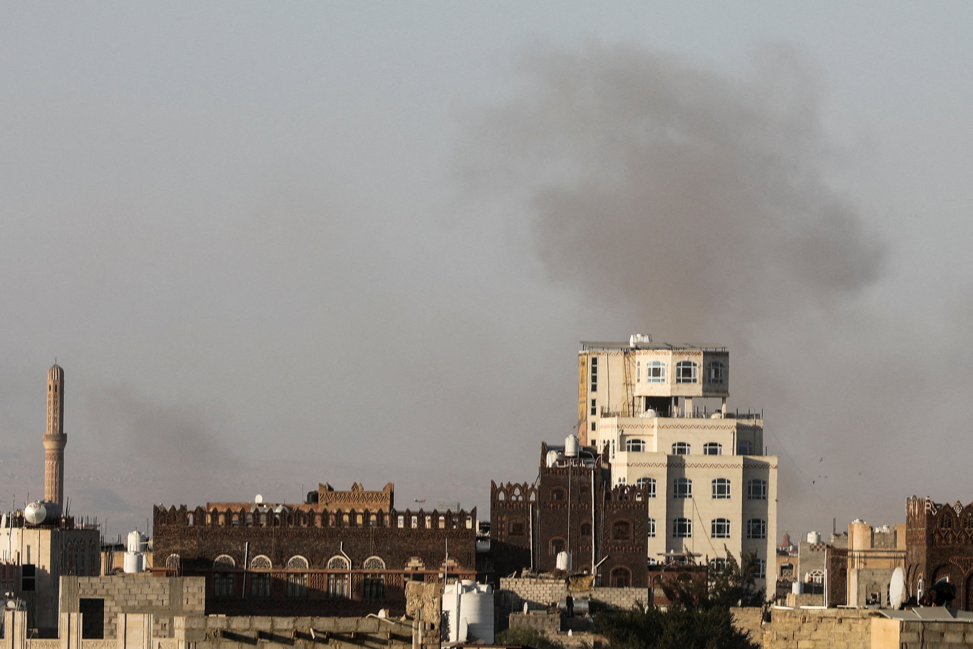 Smoke rises after Israeli strikes near Sanaa airport in Yemen