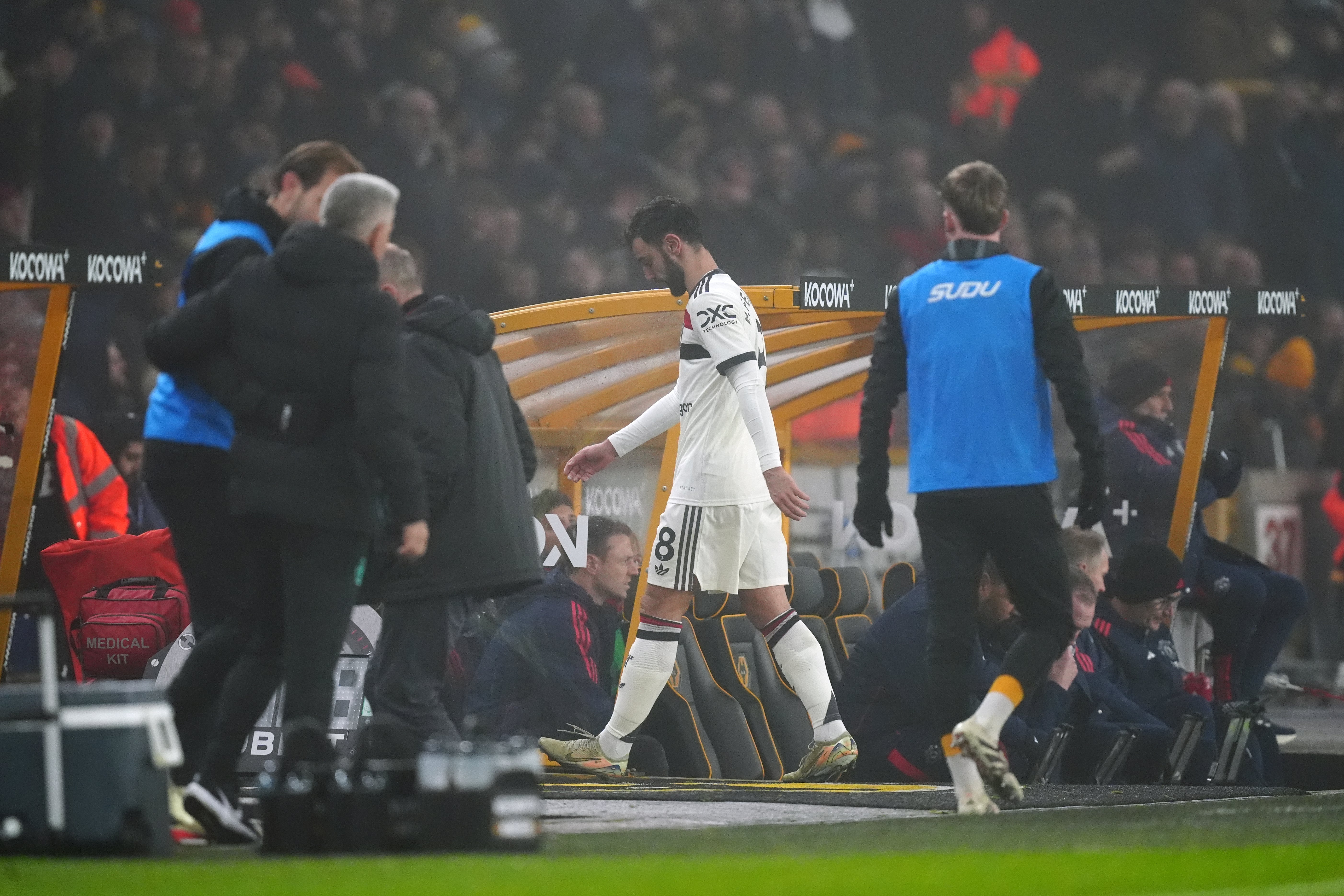 Bruno Fernandes walks off the pitch after seeing red