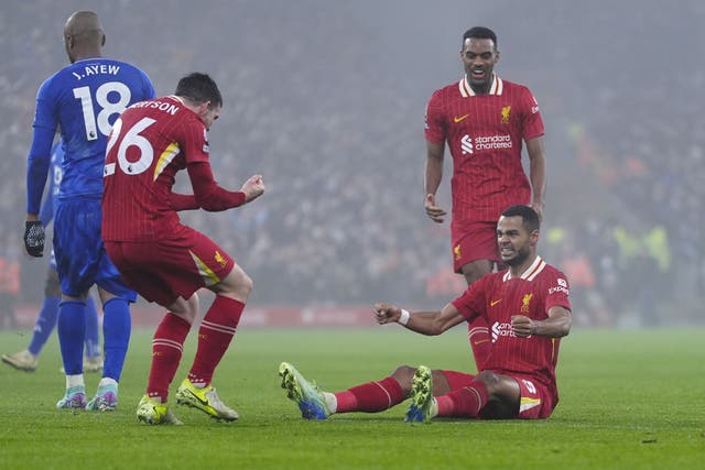 Cody Gakpo celebrates after scoring Liverpool’s first goal against Leicester (Peter Byrne/PA)