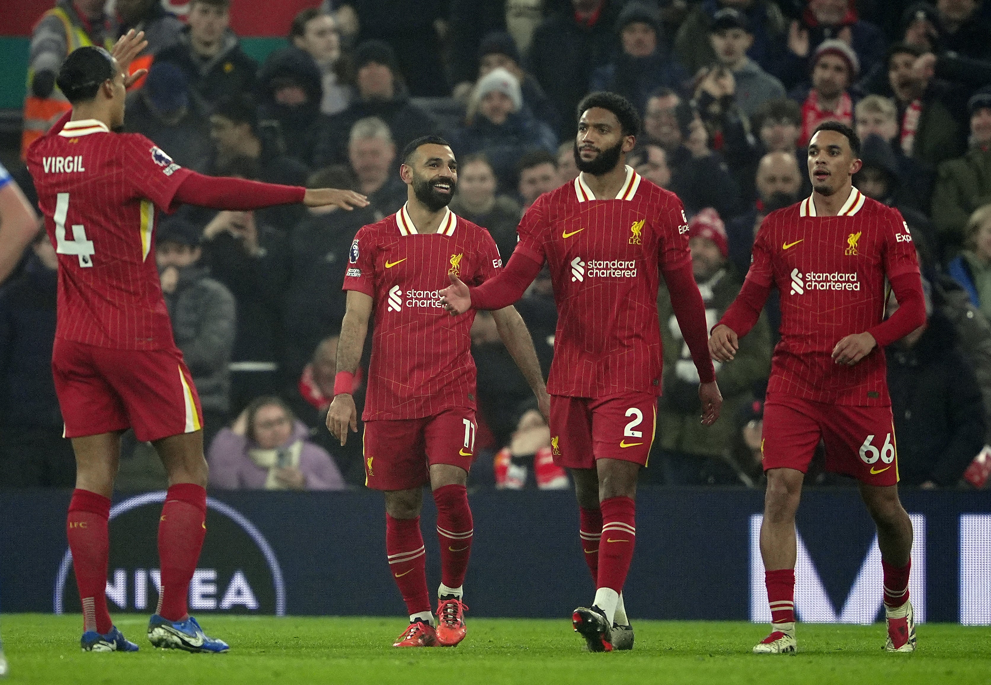 Mohamed Salah celebrates after scoring Liverpool’s third goal against Leicester