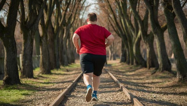 <p>Adult with obesity practicing running</p>