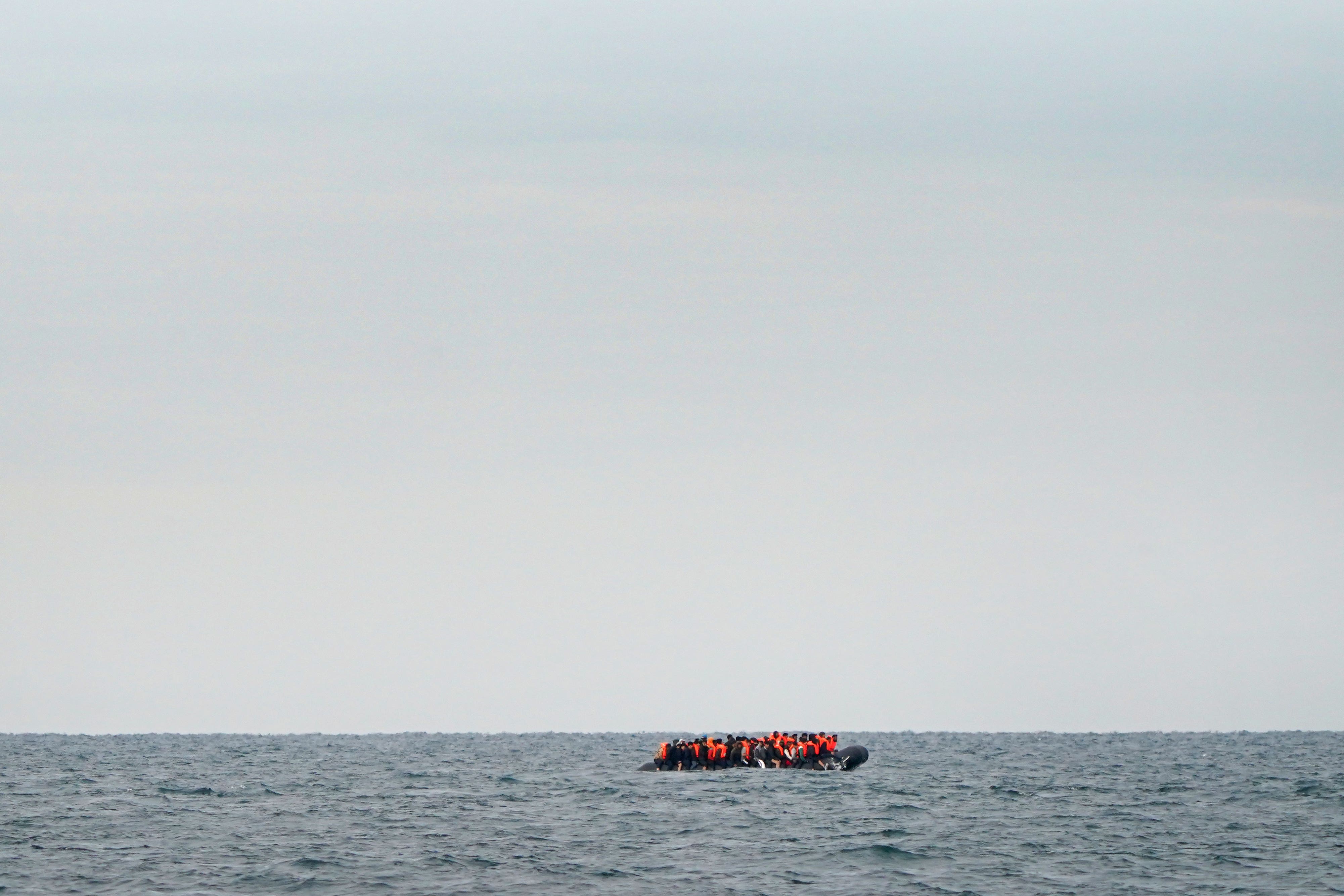 A group of people thought to be migrants crossing the Channel in a small boat travelling from the coast of France and heading in the direction of Dover, Kent, in August 2023 (Gareth Fuller/PA)