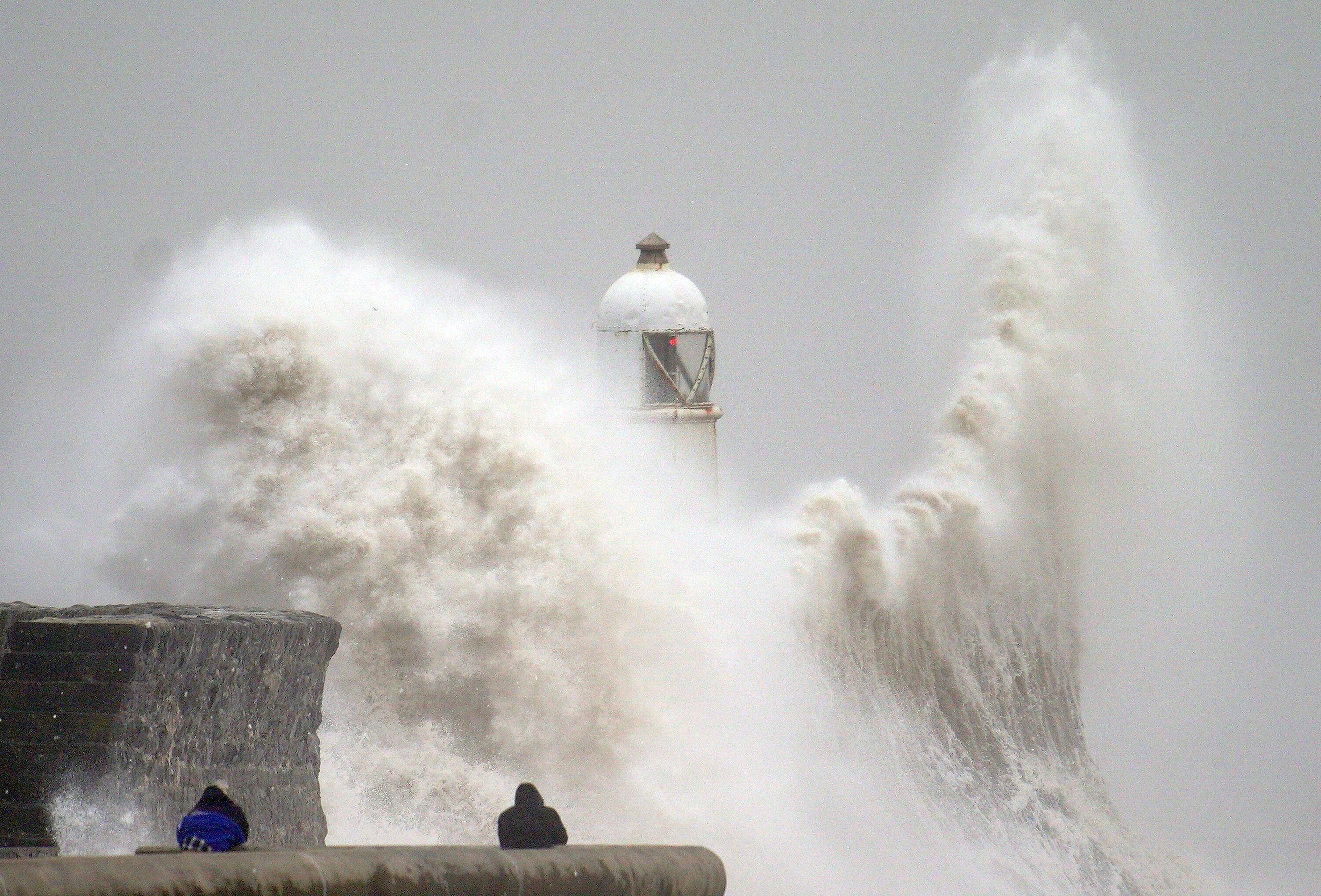 Huge waves crash over the seafront in Porthcawl, south Wales, during Storm Darragh in December