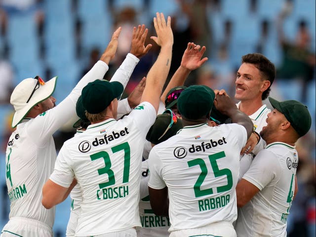 <p>South Africa's Marco Jansen, second right, celebrates with his teammates after taking a wicket of Pakistan's Kamran Ghulam</p>