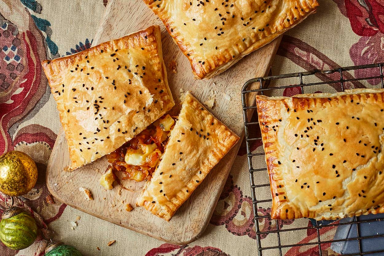 These cheesy, chutney-filled pasties are the perfect way to repurpose your festive cheeseboard into a warm, crumbly hug of flavour