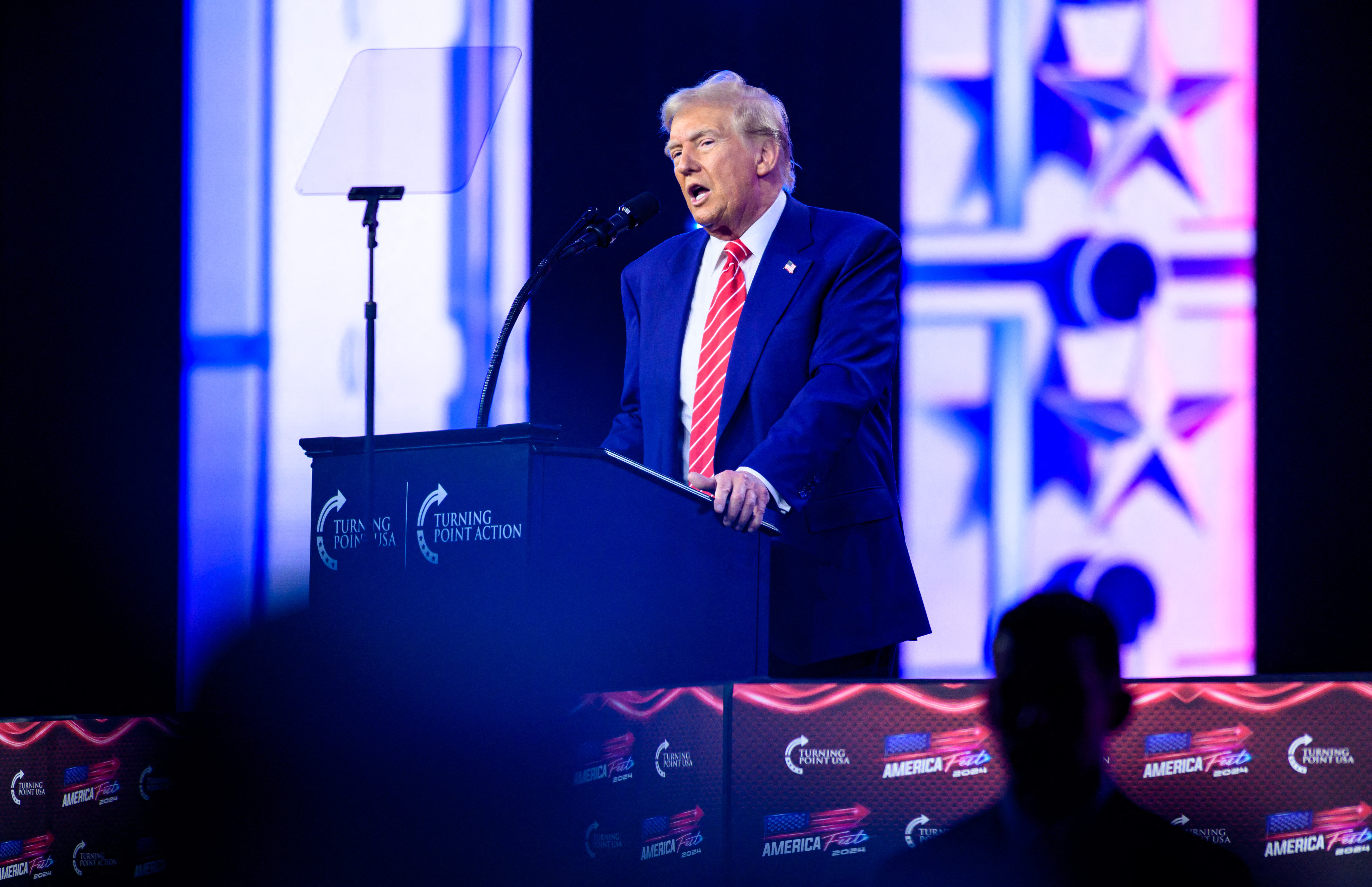 President-elect Donald Trump speaks during Turning Point's annual AmericaFest 2024 in Phoenix, Arizona, on December 22, 2024. His threats of imposing tariffs have set off a mad scramble among companies to find new suppliers