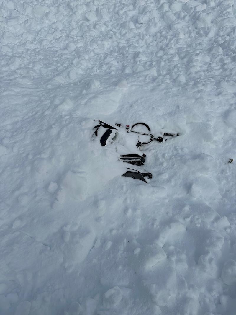 Gear is seen under snow after an avalanche resulted in a scary situation for a Utah family. Now, officials are warning of further danger in the state this weekend