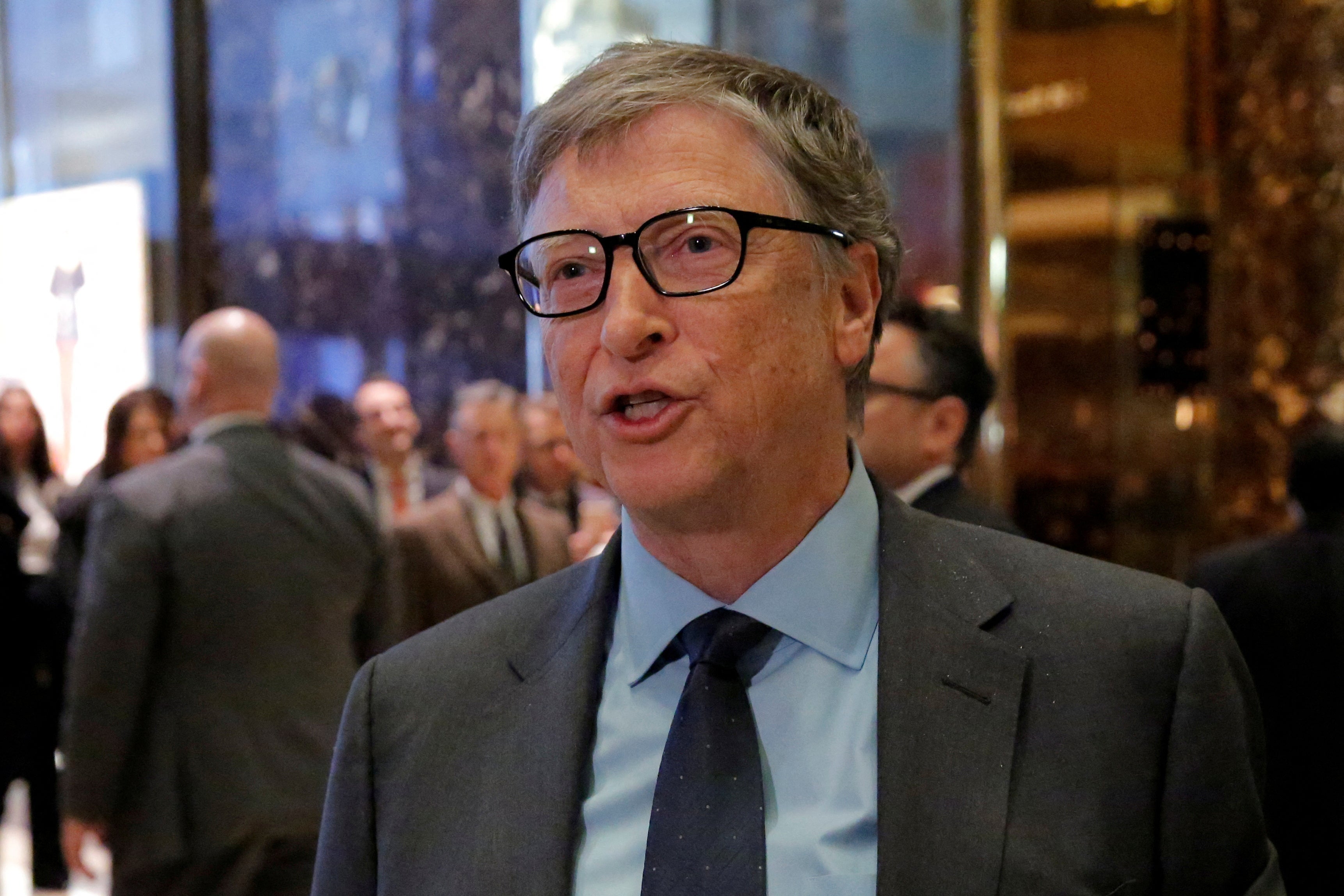 Businessman Bill Gates exits through the lobby at Trump Tower in Manhattan, New York City in December 13, 2016