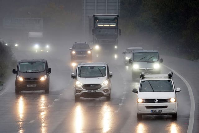 Heavy rain is expected to result in difficult driving conditions in the build-up to New Year (Gareth Fuller/PA)