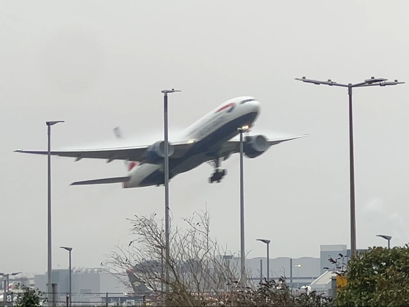 Into the gloom: A British Airways Boeing 787 taking off at London Heathrow