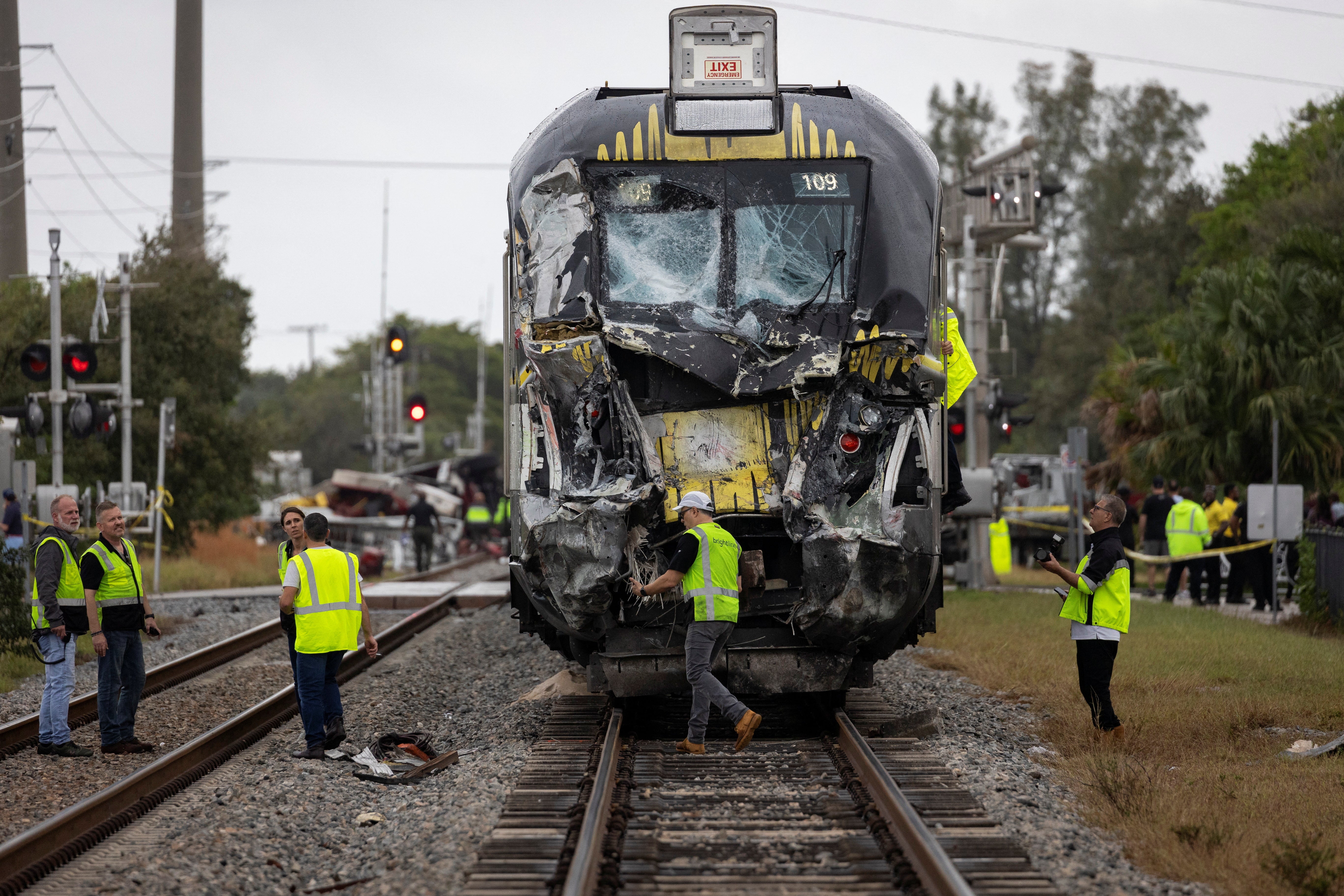 Delray Beach Police officers and Brighline personnel are seen at the scene after a Brightline passenger train collided with a fire truck on railtracks in Delray Beach, Florida, U.S. December 28, 2024