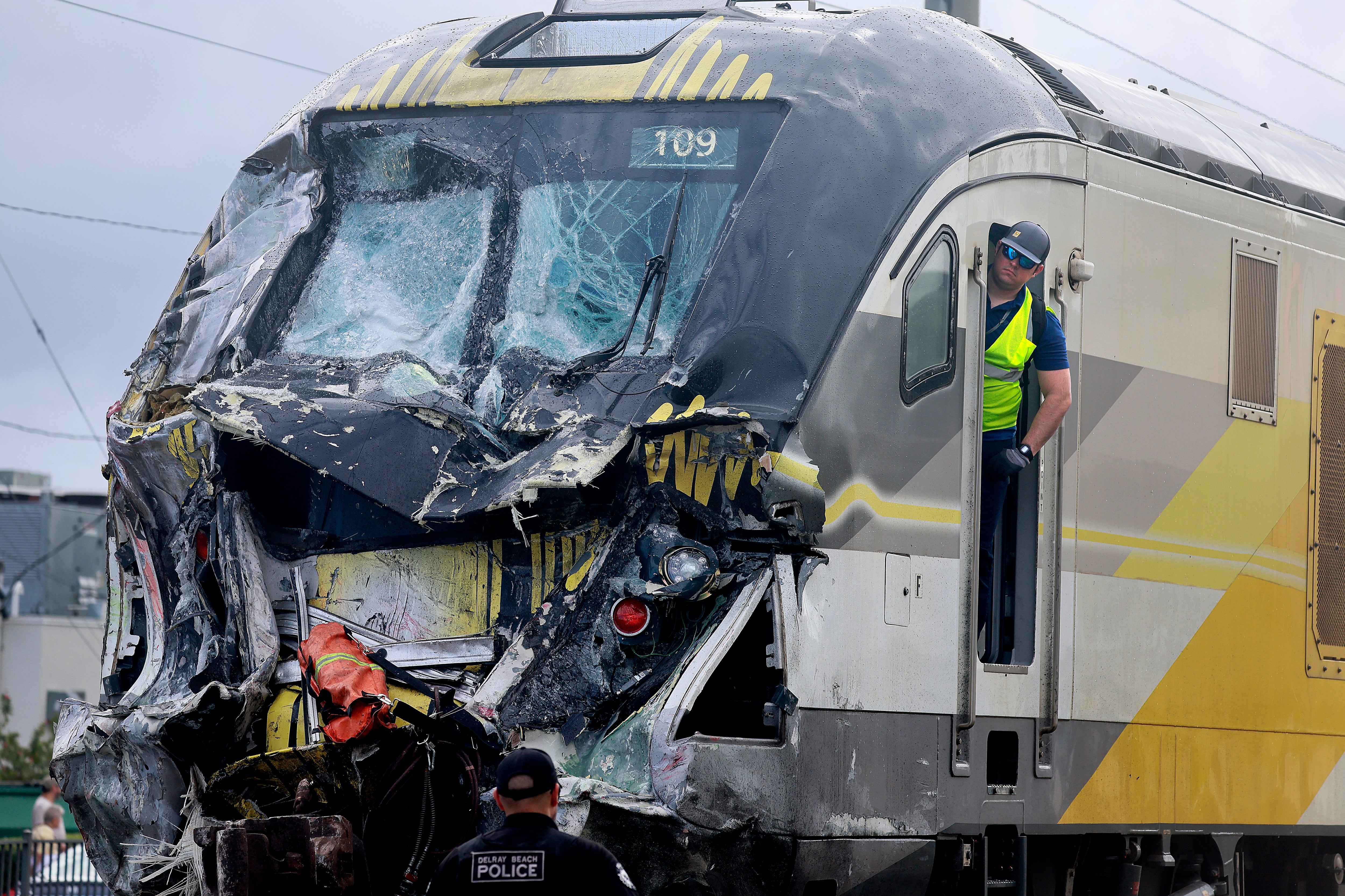 <p>A damaged Brightline train is seen after it collided with a fire truck in downtown Delray Beach, Florida, Saturday, December. 28, 2024. A former Brightline conductor is suing for the company for $60 million, claiming the deaths he witnessed while working for the company has left him with psychological injuries</p>