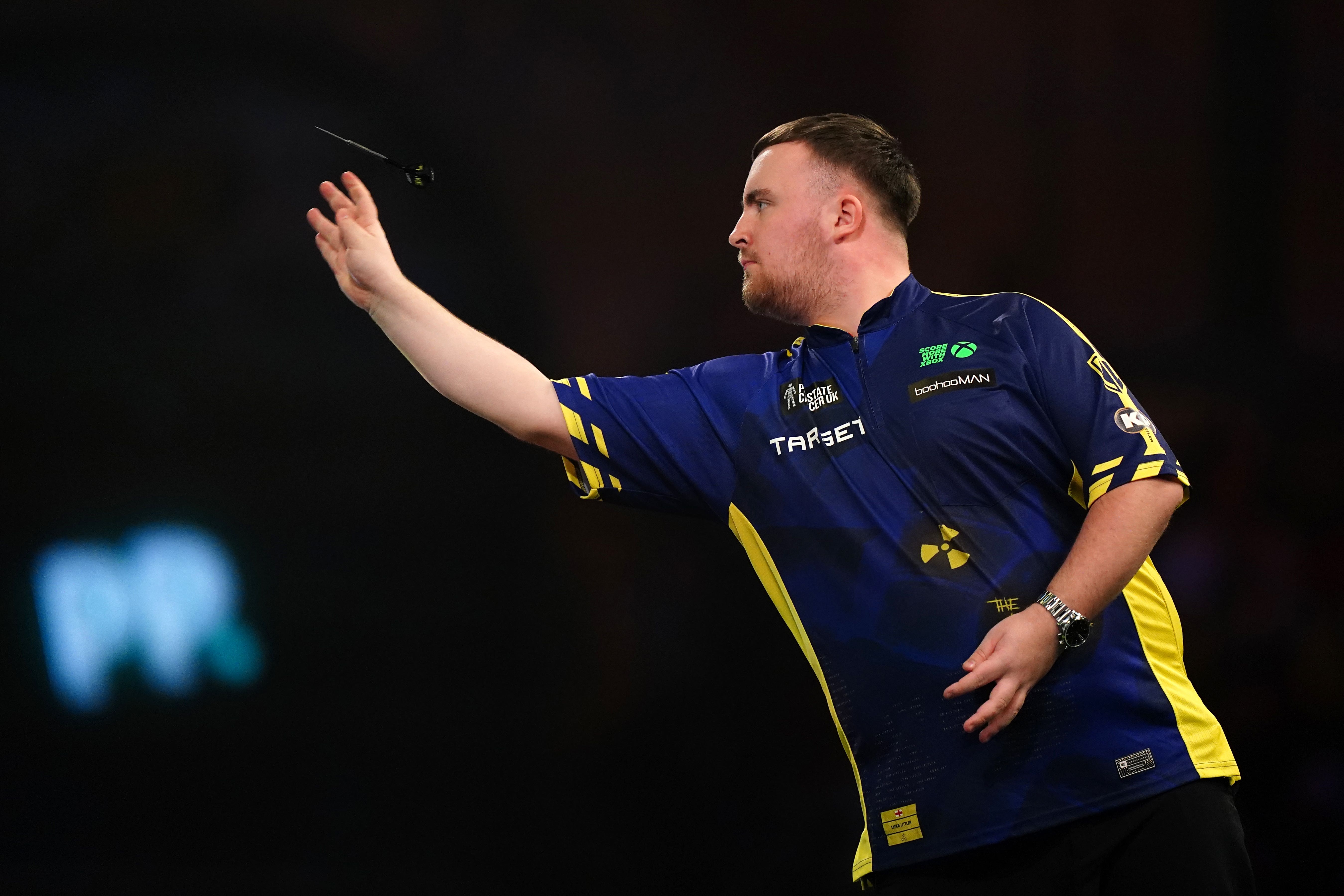 Luke Littler overcomes slow start to progress at World Darts Championship