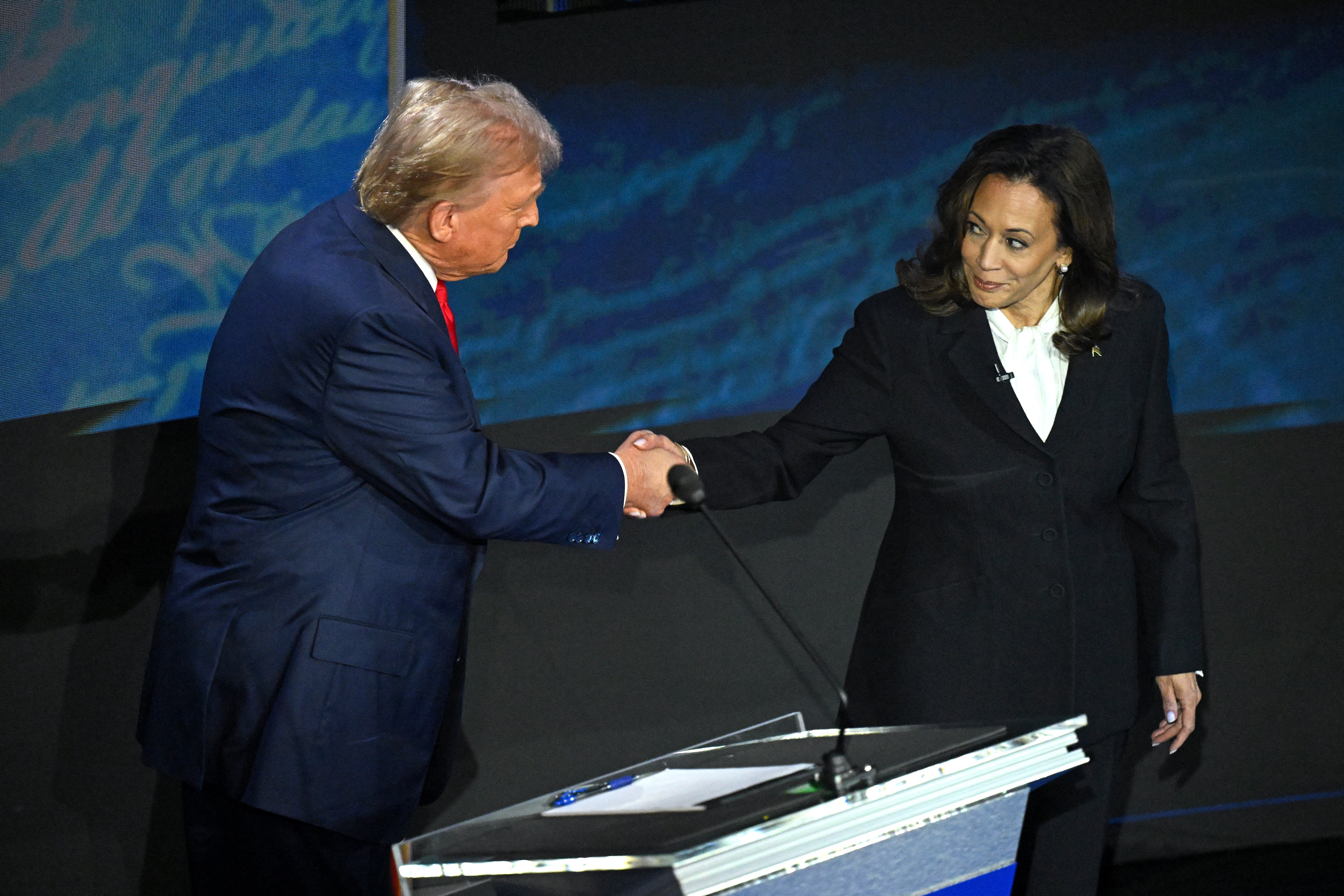 Vice President Kamala Harris shakes hands with Donald Trump during a presidential debate. She will have to certify his election victory on January 6, after months of warning American voters that he was a threat to democracy