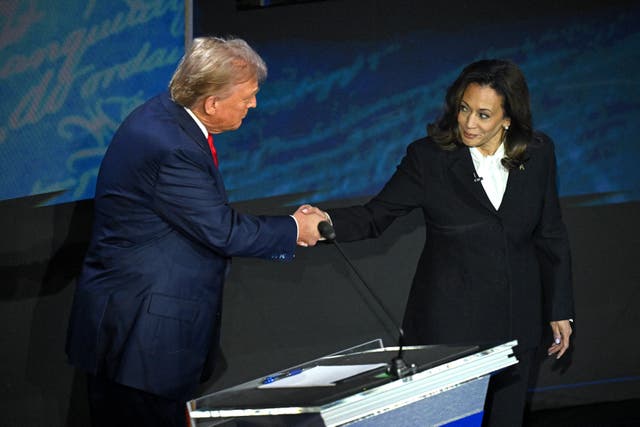 <p>Vice President Kamala Harris shakes hands with Donald Trump during a presidential debate. She will have to certify his election victory on January 6, after months of warning American voters that he was a threat to democracy </p>