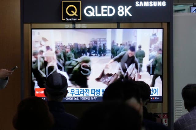 <p>File. A TV screen in Seoul shows an image of soldiers believed to be from North Korea in Russia</p>