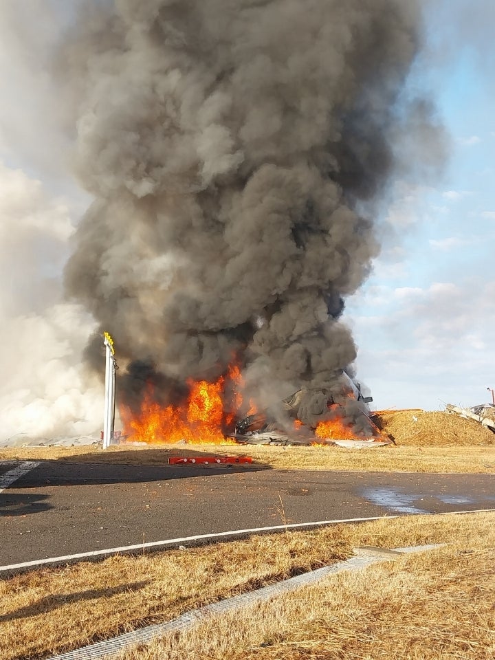 Jeju Air Flight 7C2216 burns after skidding off the runway at Muan International Airport