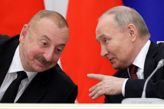 <p>Azerbaijan’s president Ilham Aliyev talks with Vladimir Putin in April </p>