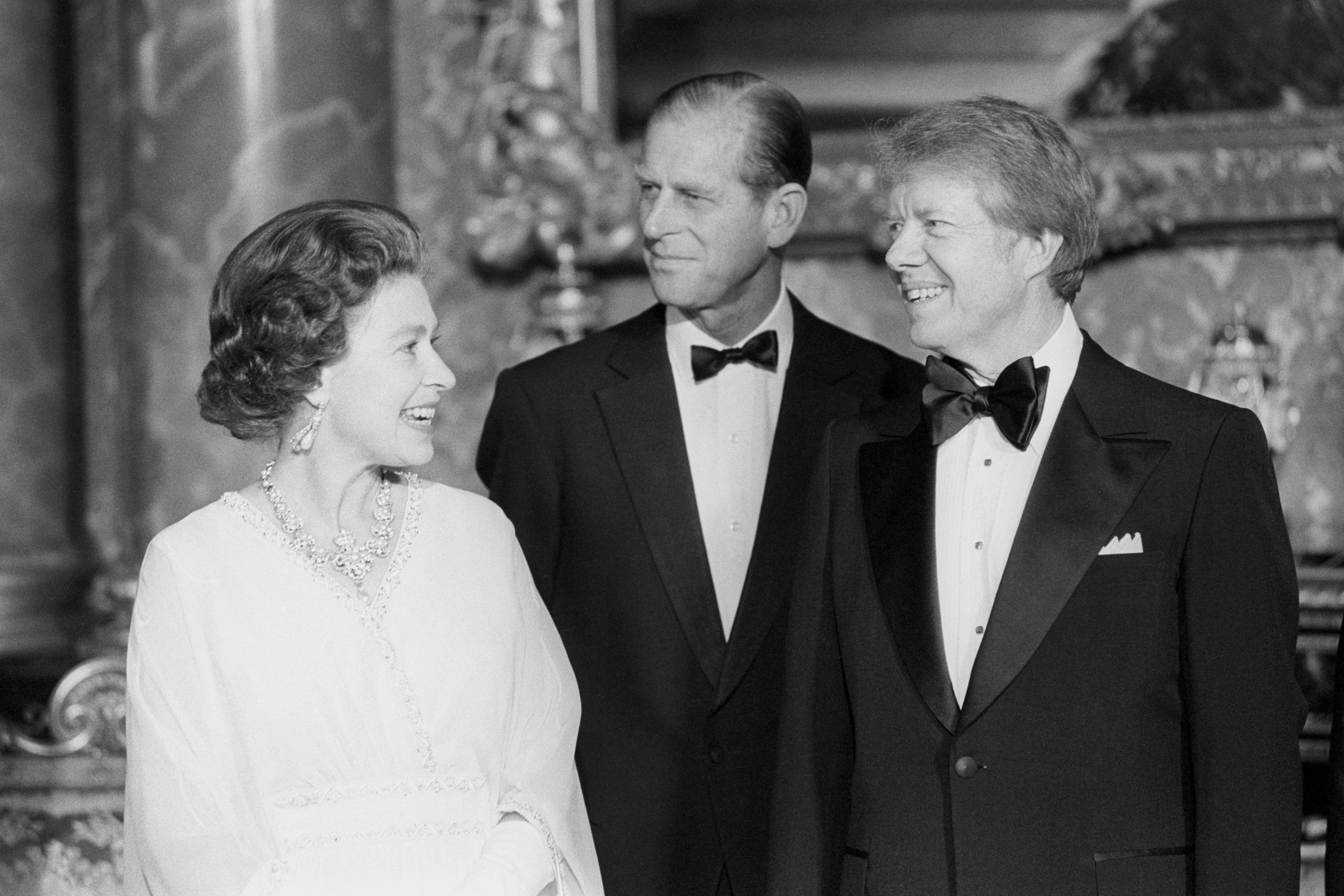 President Jimmy Carter joins the Queen and the Duke of Edinburgh at Buckingham Palace (Archive/PA)