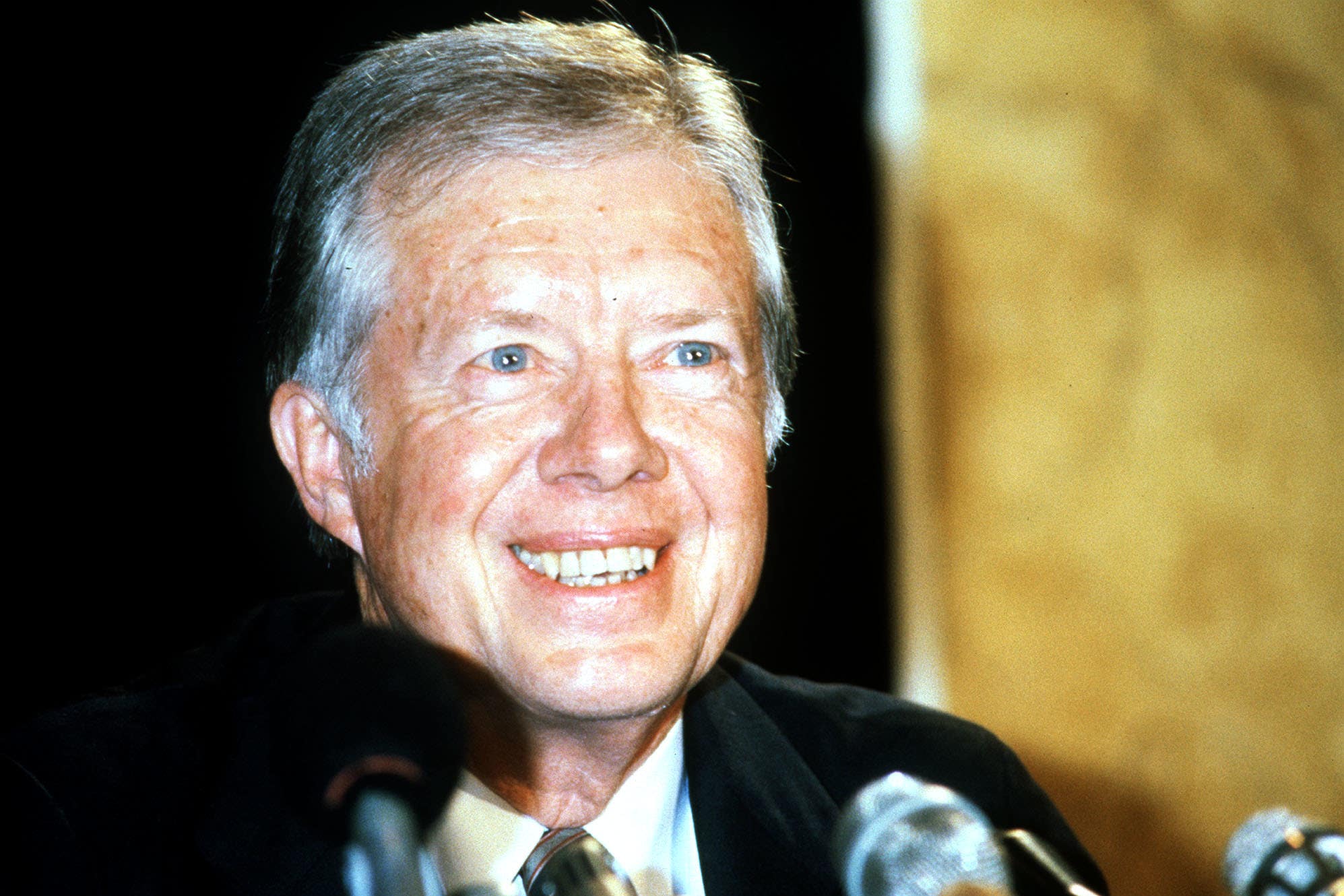 Jimmy Carter during a press conference on a private visit to London (PA)