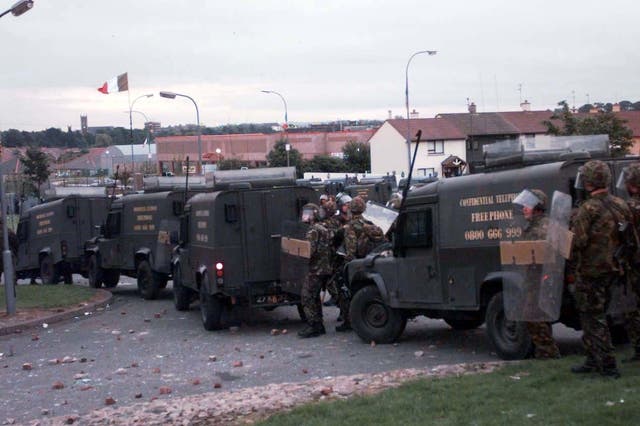 Soldiers and their armoured vehicles on the Garvaghy Road in Drumcree in 1997 (PA Archive)