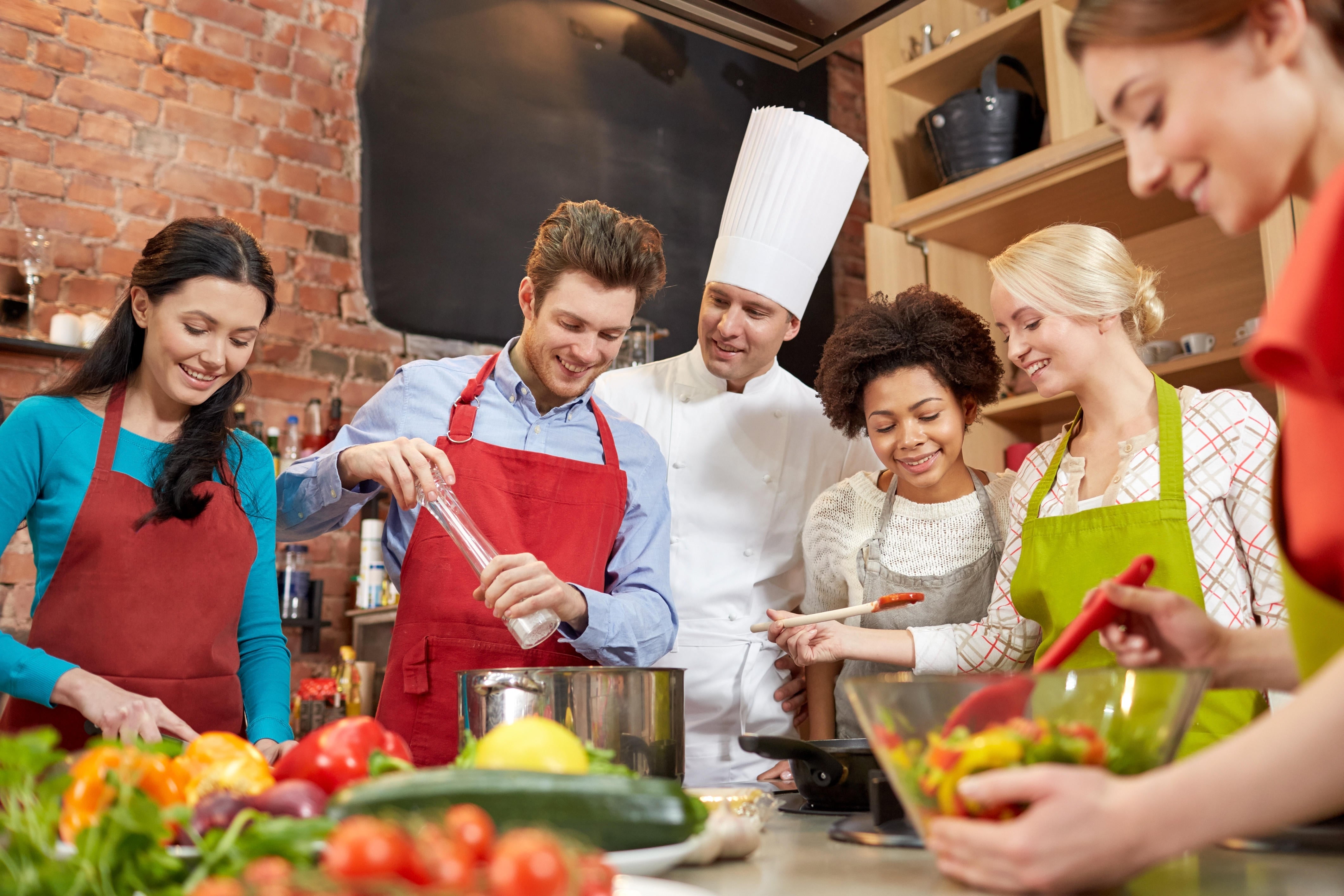 A group of friends enjoying a cooking class