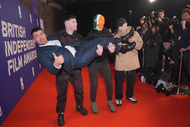 Members of Kneecap holding aloft director Rich Peppiatt attending the British Independent Film Awards ceremony at London’s Roundhouse. Picture date: Sunday December 8, 2024.