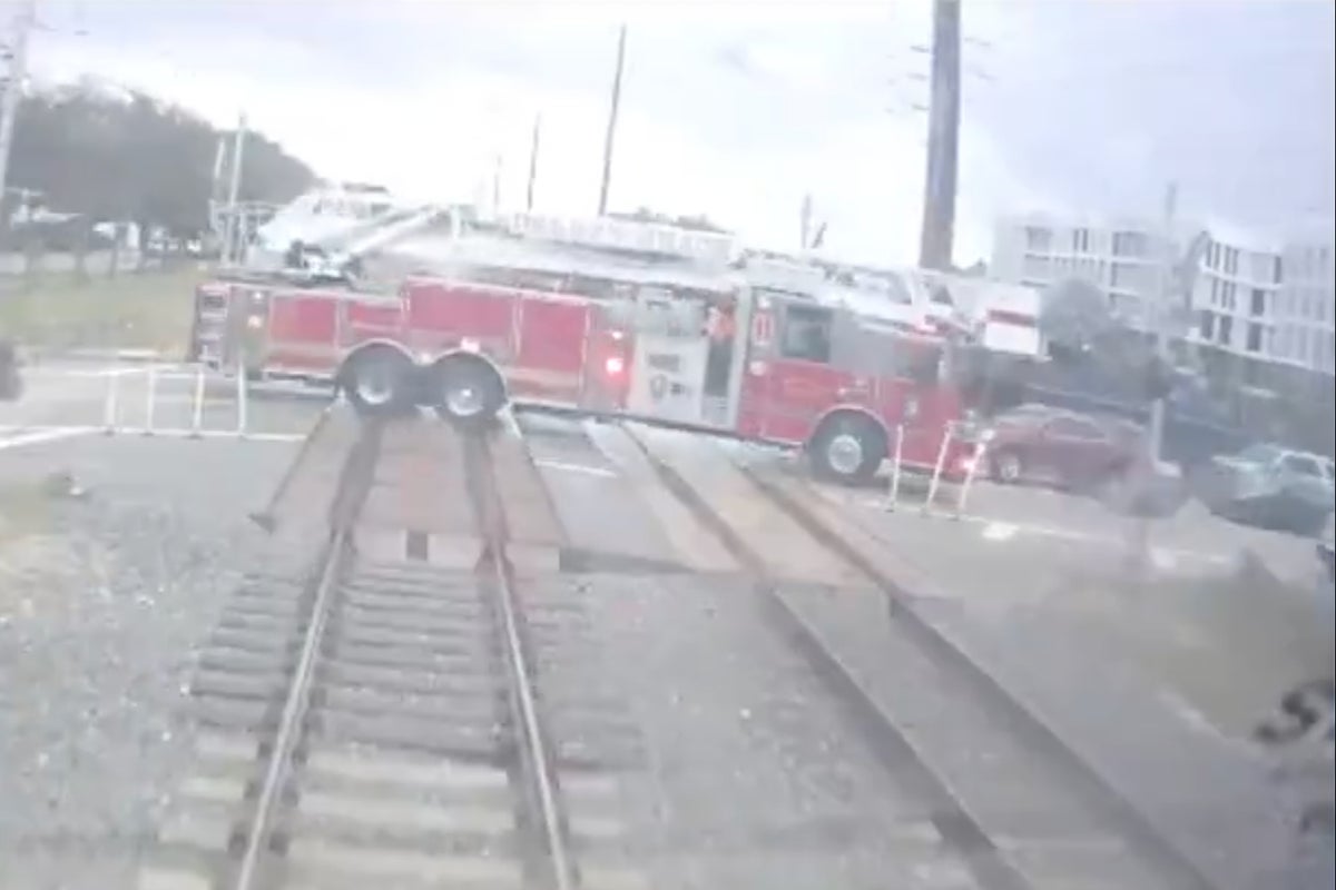 Watch: Passenger train drives into fire engine after it ‘drove through crossing gates’