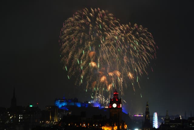 <p>Fireworks explode over Edinburgh Castle during the street party for Hogmanay New Year last year as this year’s celebrations are cancelled due to extreme weather</p>