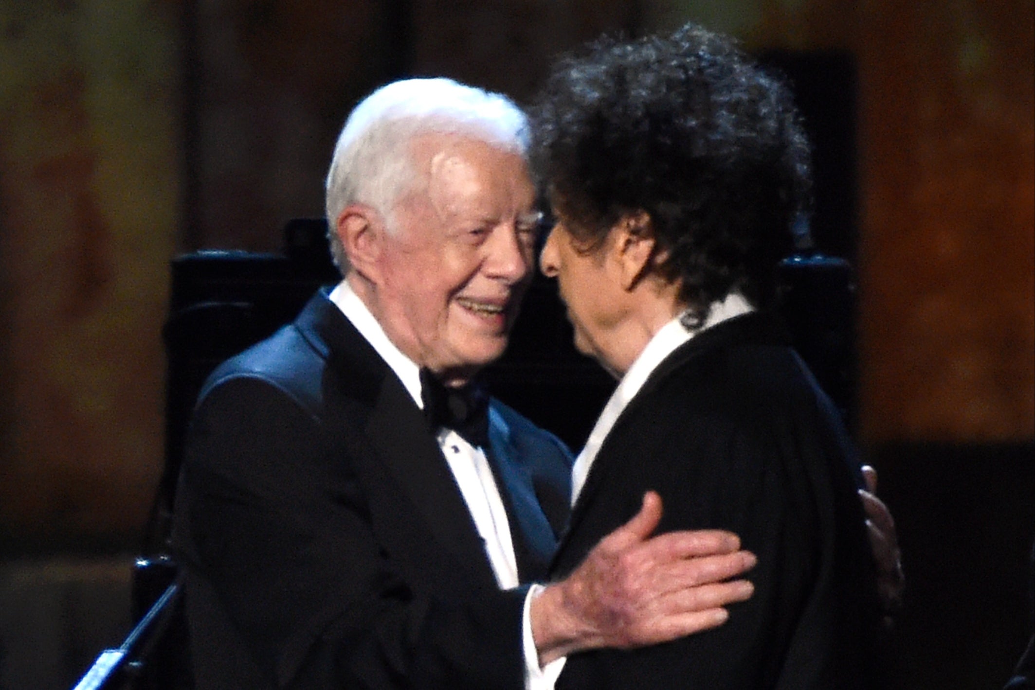 Carter embracing Bob Dylan at the MusiCares 2015 Person Of The Year Gala in Los Angeles