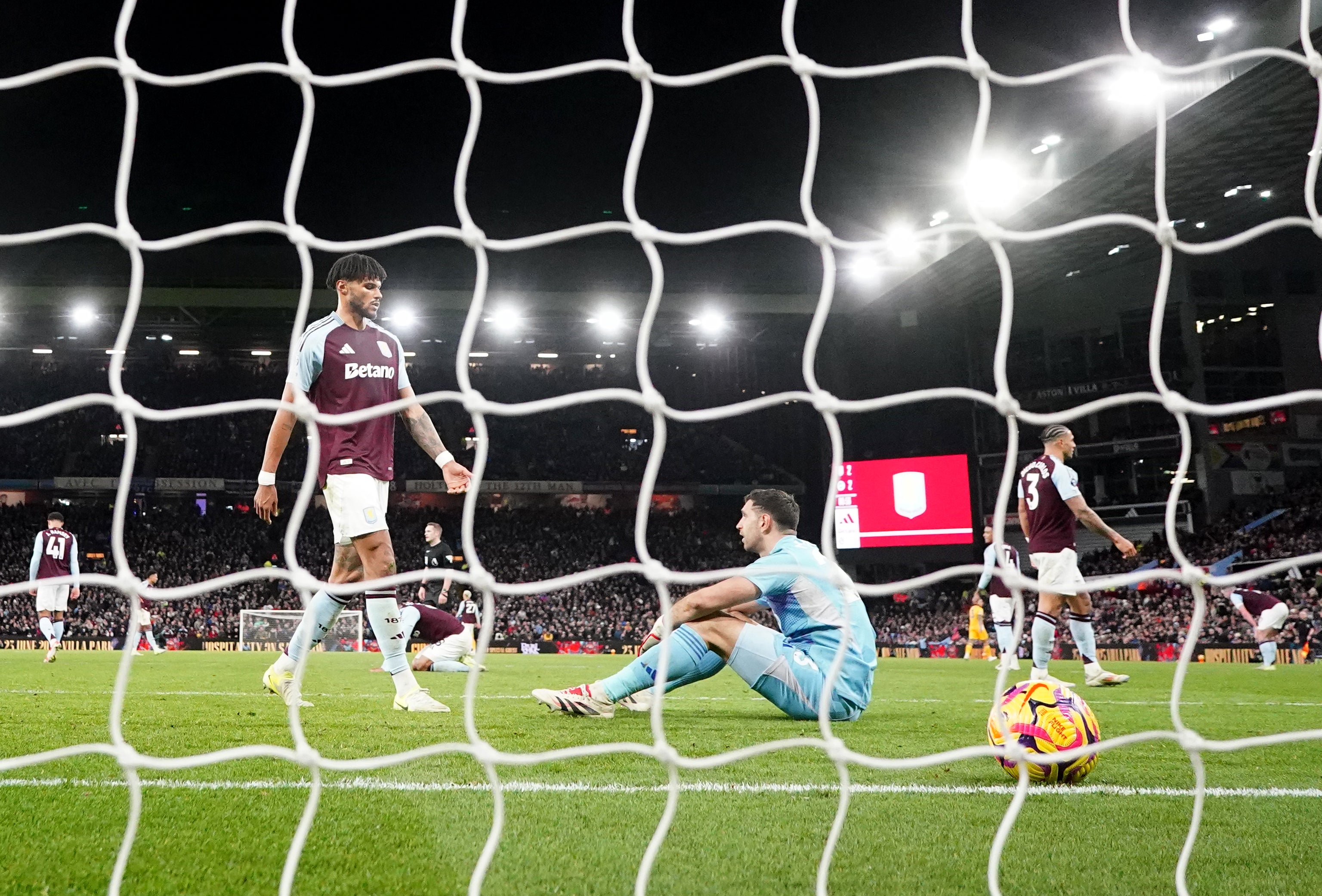 Aston Villa’s Tyrone Mings and goalkeeper Emiliano Martinez after conceding their second goal (David Davies/PA)