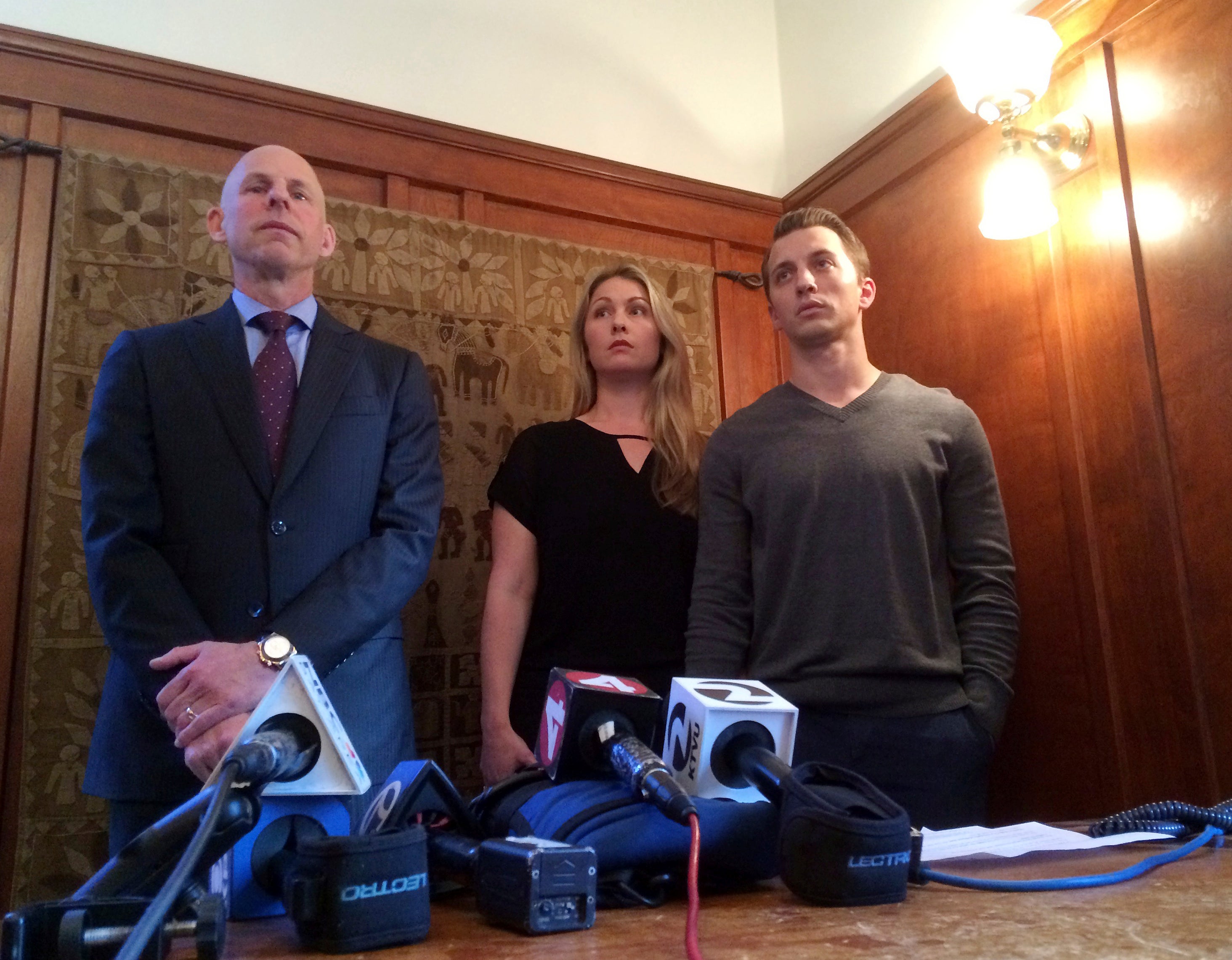 Lawyer Anthony Douglas Rappaport speaks at a news conference with his clients, Denise Huskins and her boyfriend Aaron Quinn, right, in San Francisco