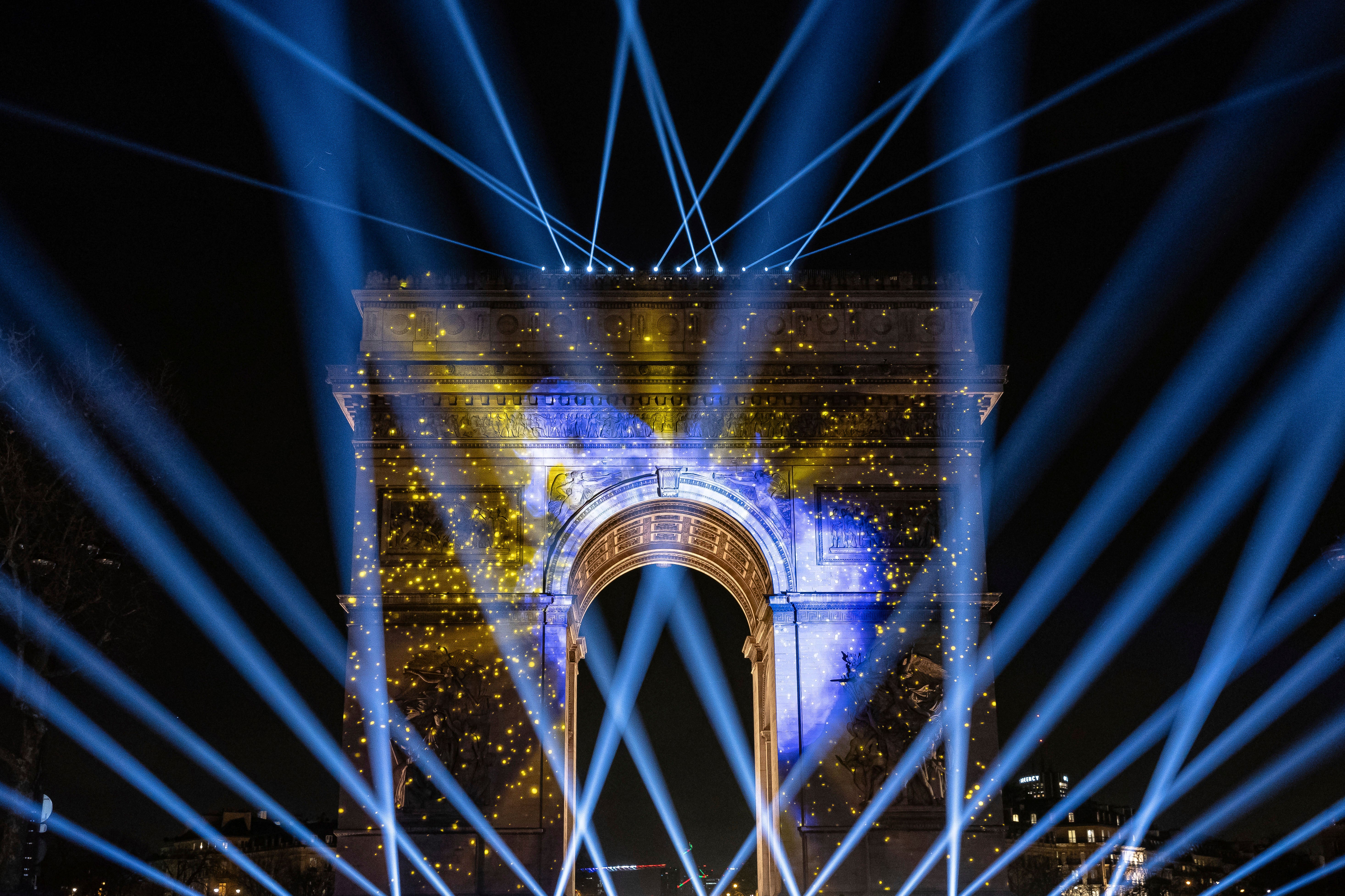 A light show is projected on the Arc de Triomphe during a New Year’s celebration on the Champs Elysees in Paris