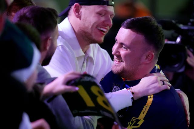 Luke Littler is into the last eight at Ally Pally (John Walton/PA)