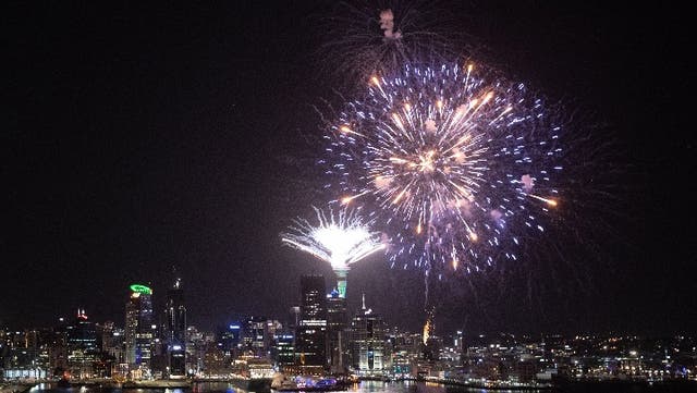 <p>Fireworks are seen exploding from the Auckland’s Waitemata Harbour and Sky Tower during the Auckland New Year's Eve celebrations on January 01, 2020 in Auckland, New Zealand</p>