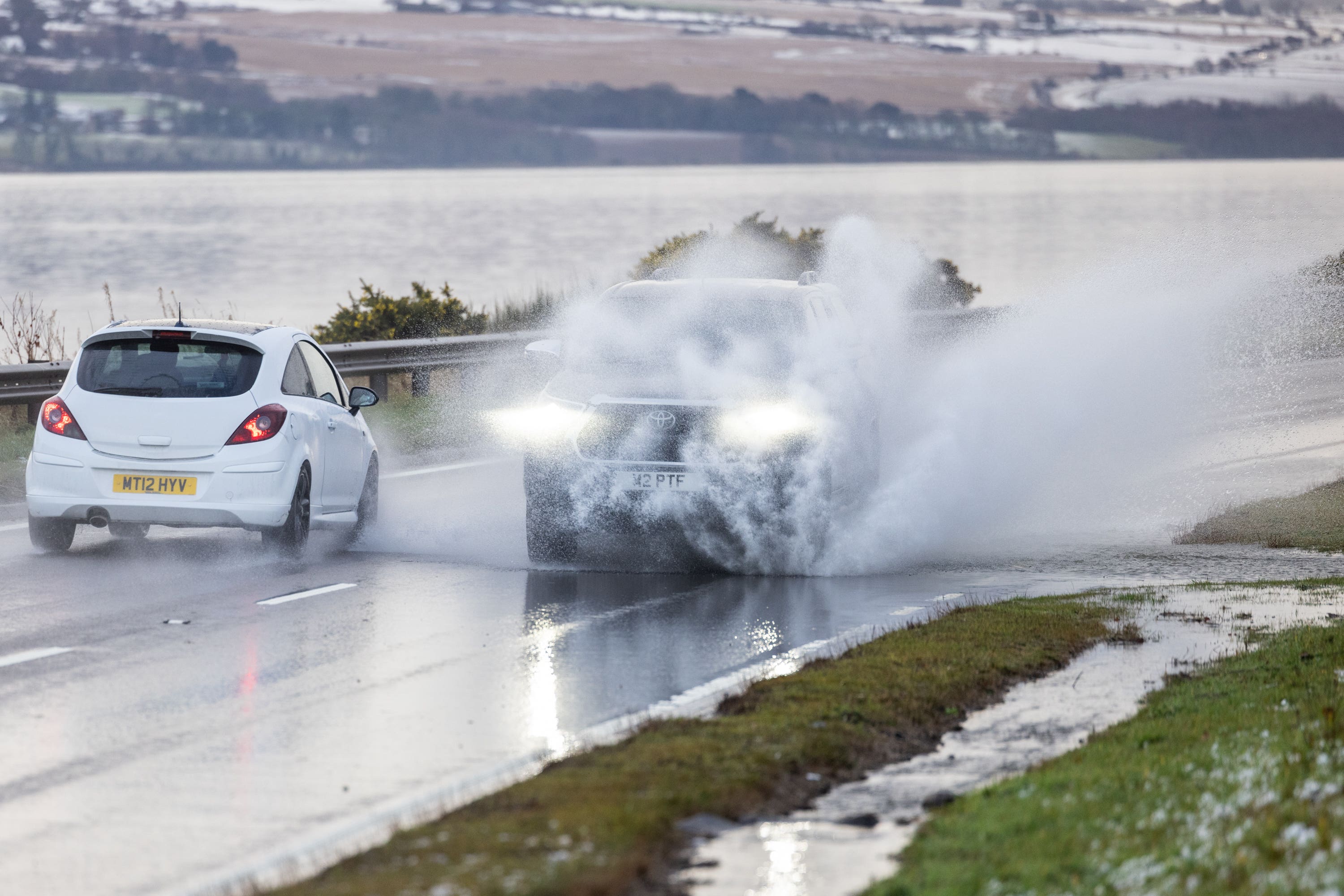 Vehicles drive on the A9 in Inverness following heavy rain (Paul Campbell/PA)