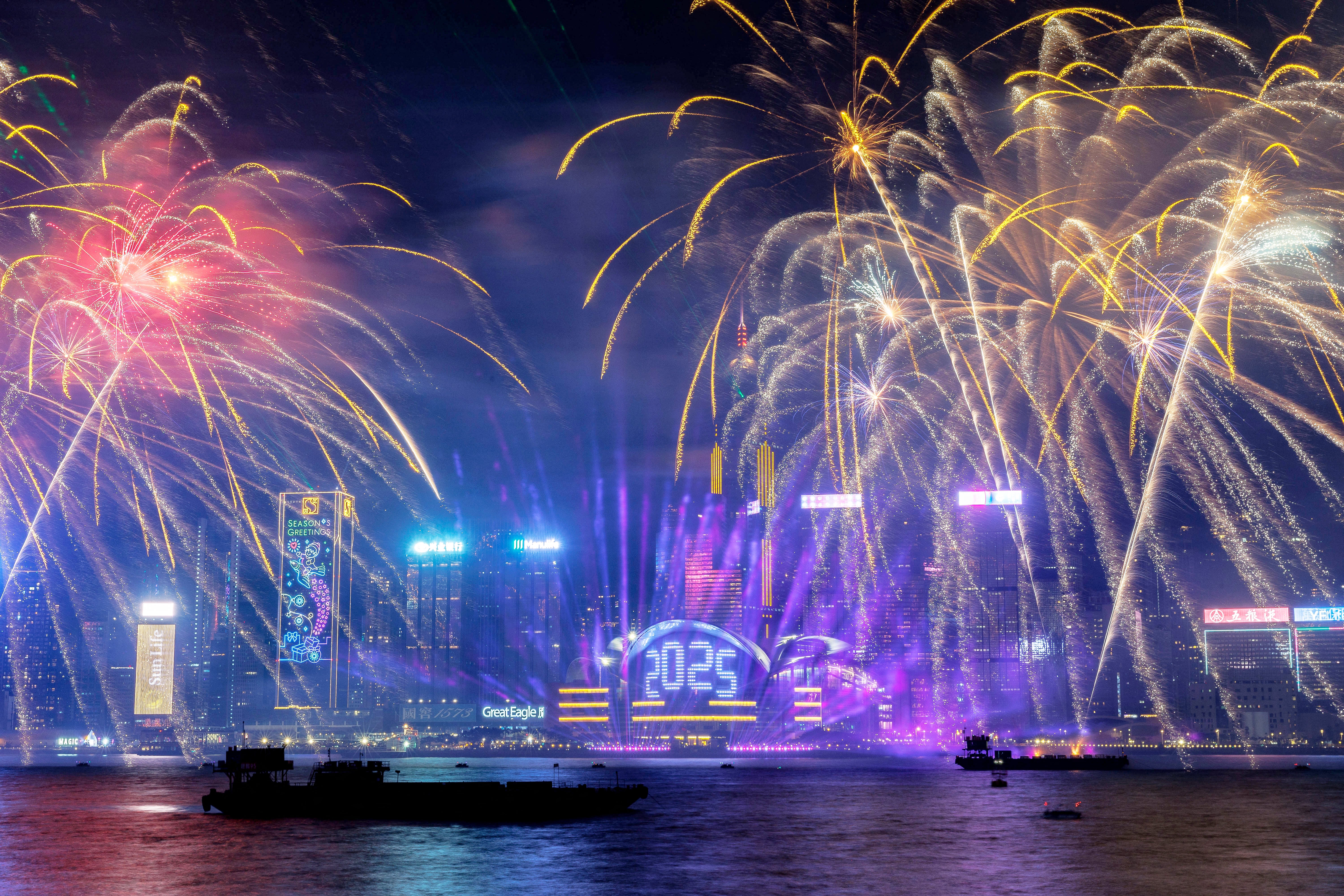 Fireworks light up the midnight sky over Victoria Harbour