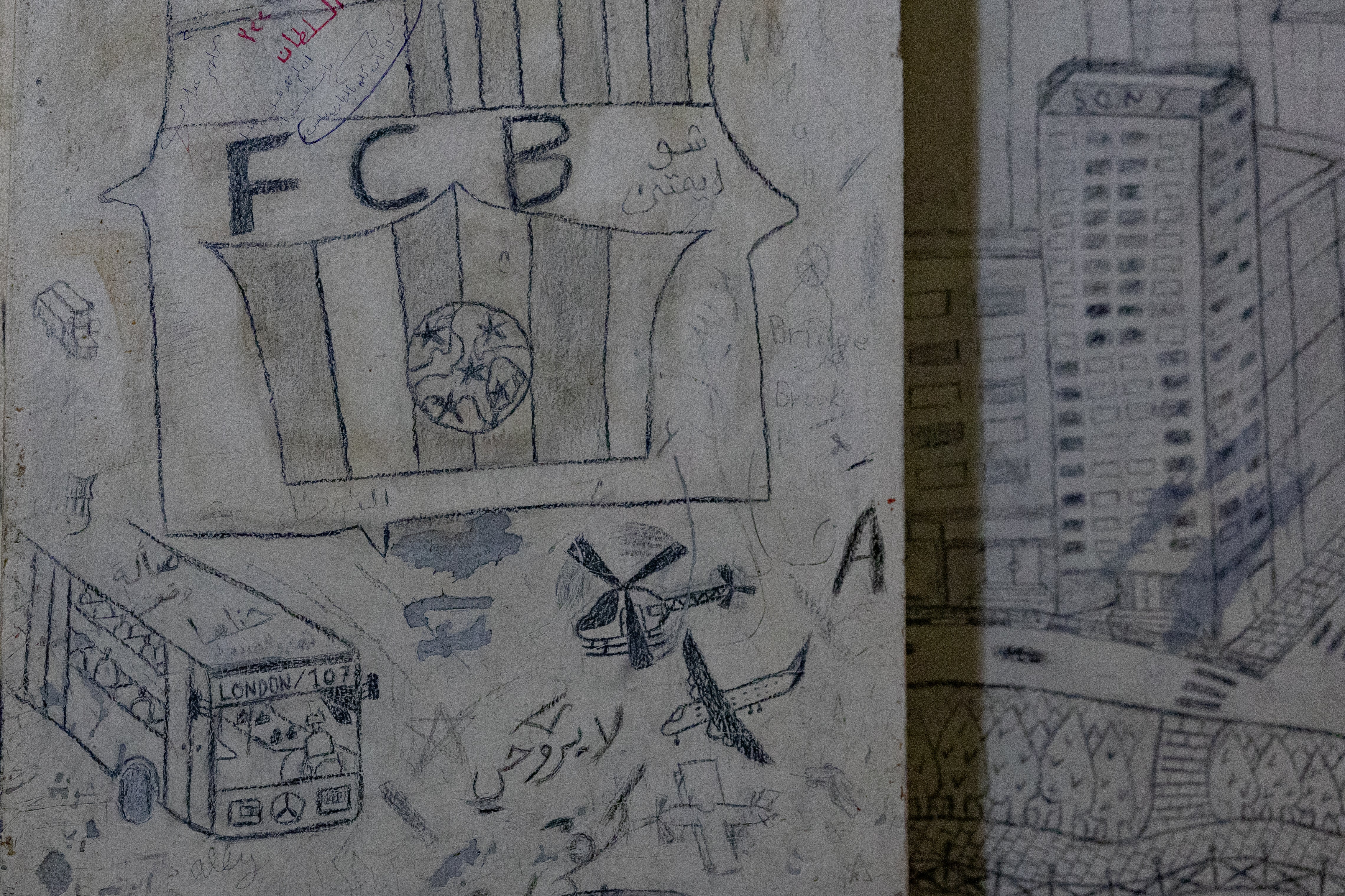 Graffiti on the walls from prisoners in the state security headquarters compound in Damascus