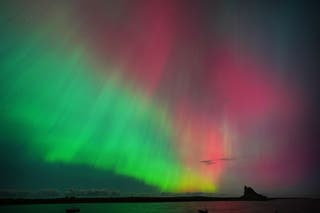 The Northern Lights previously seen in an incredible display in the skies over Lindisfarne Castle in Northumberland