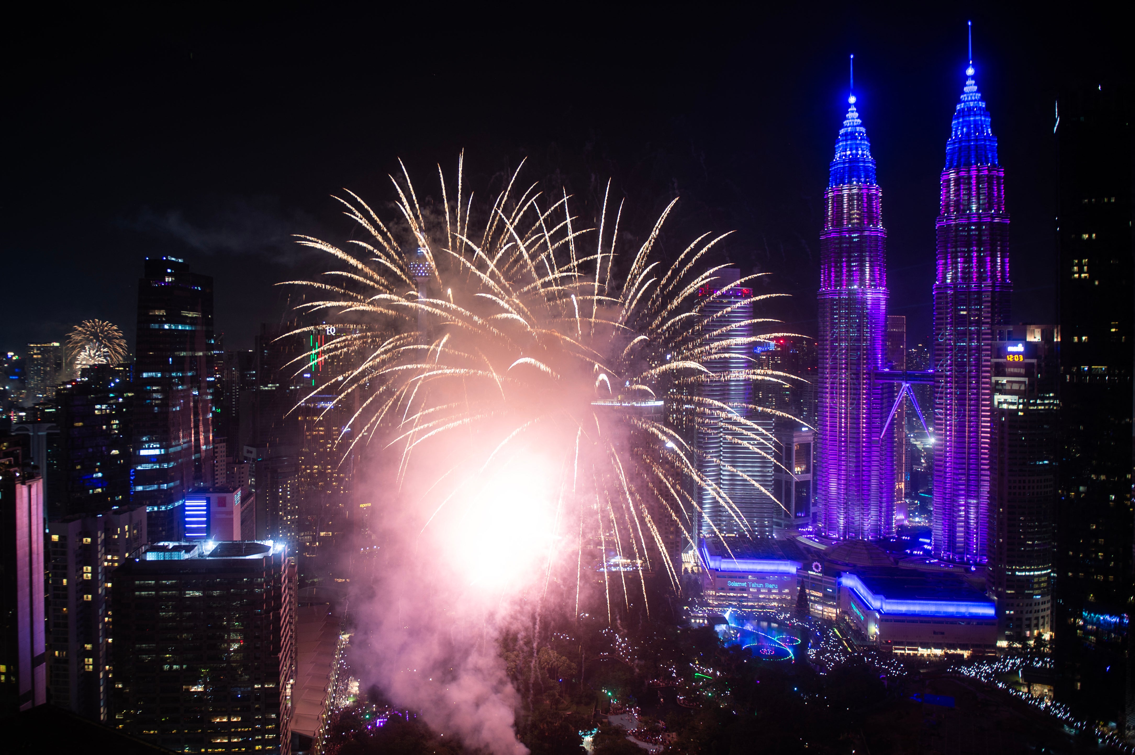 Fireworks go off over the Petronas Twin Tower during celebrations in Kuala Lumpur