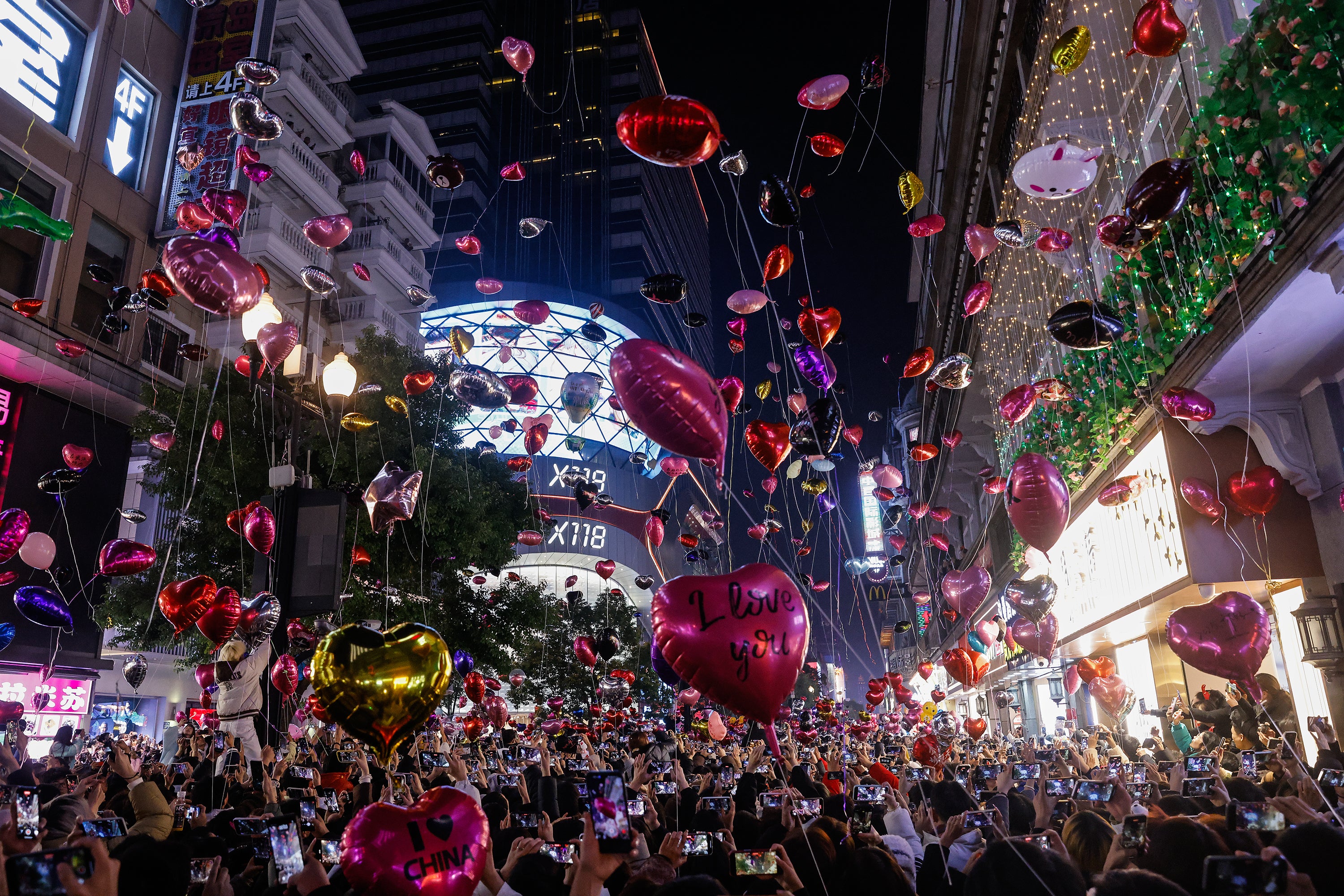 People release balloons into the air to celebrate the New Year in Wuhan