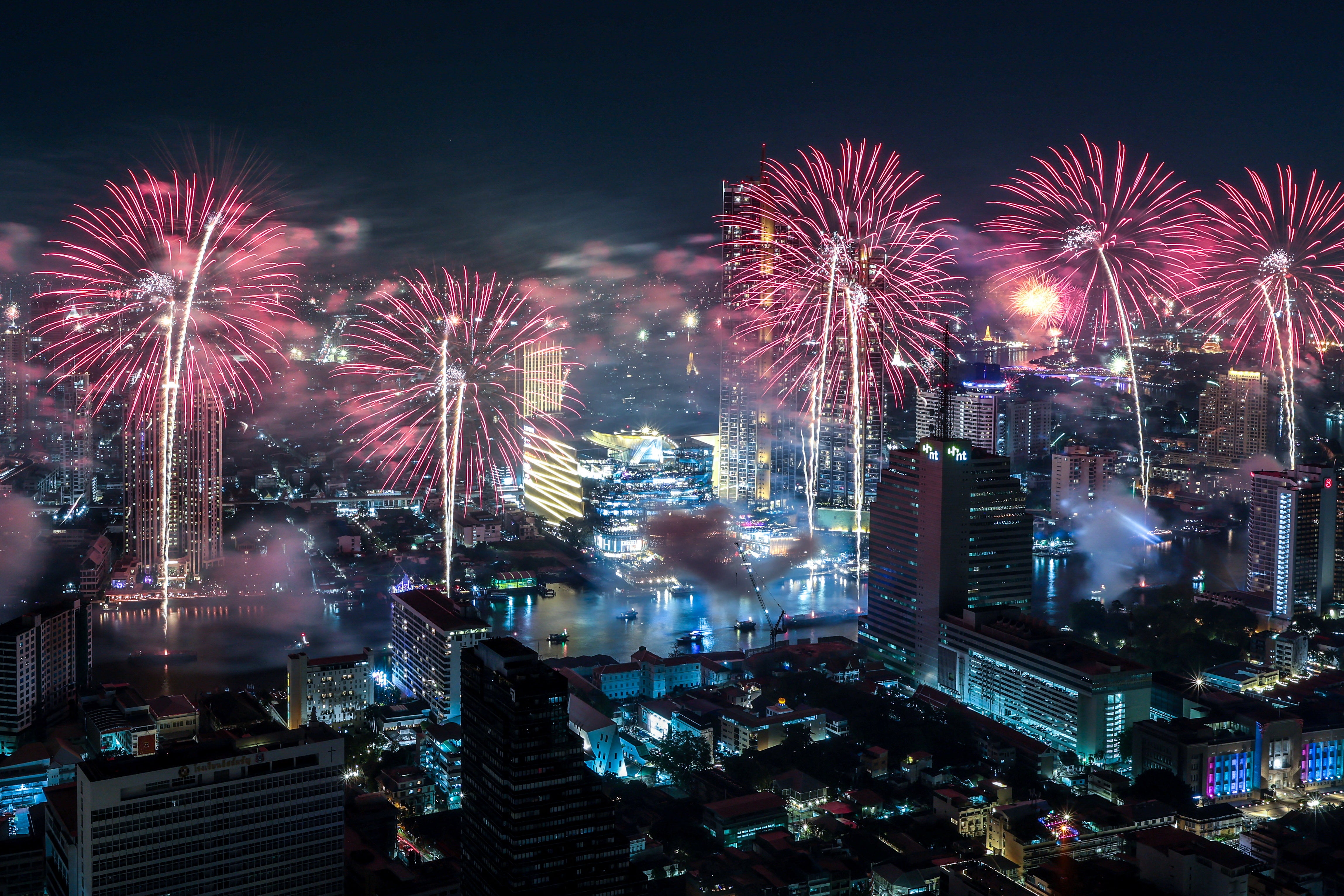 The Bangkok skyline disappears behind firework blasts