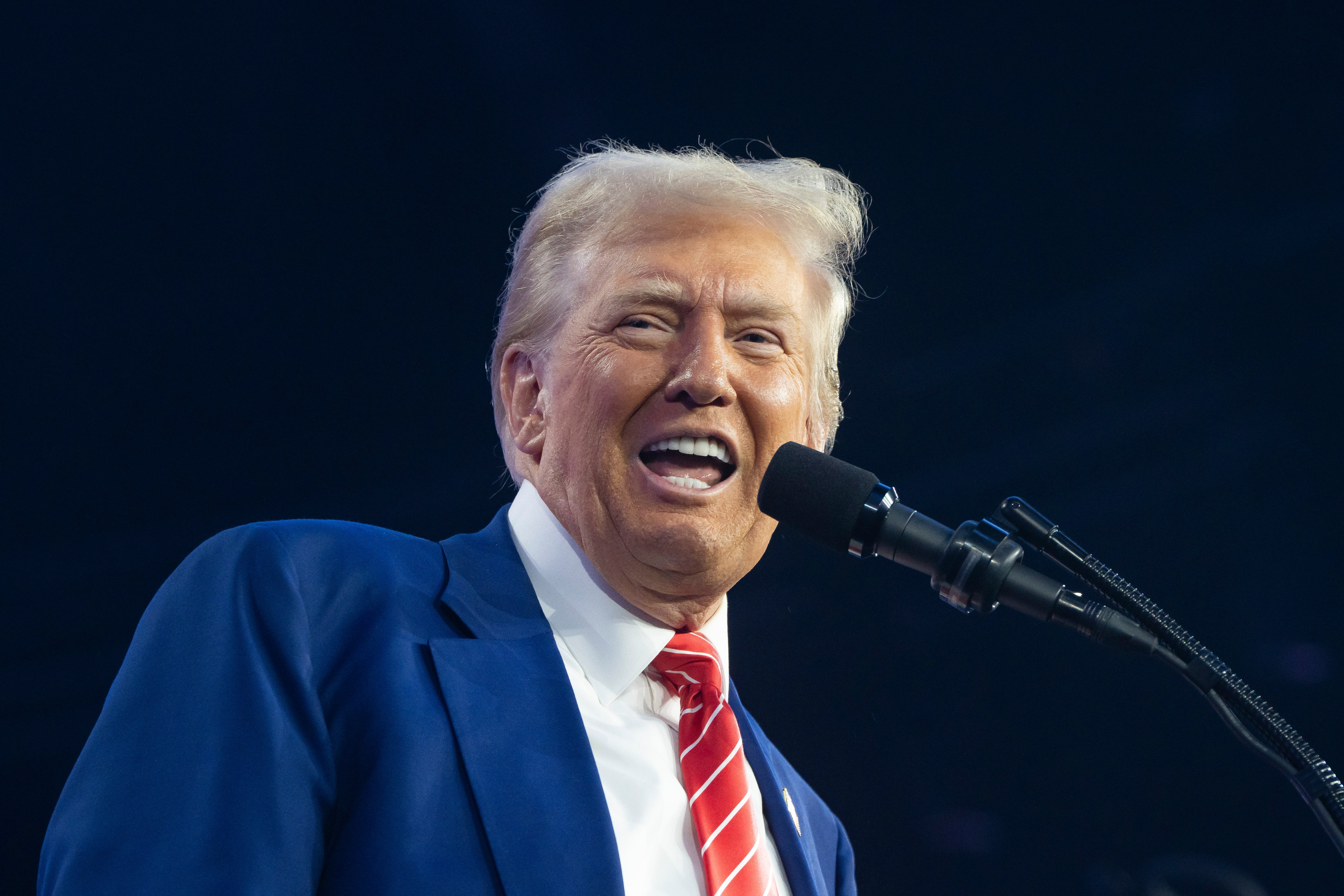 President-elect Donald Trump speaks during Turning Point USA's AmericaFest at the Phoenix Convention Center last week in Phoenix, Arizona. Russian propagandists believe his expansionist statements are helpful to Putin