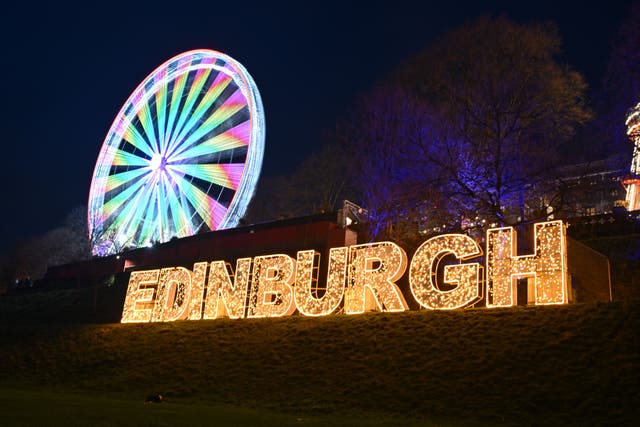 Tourists who came to Edinburgh hopiing to see the Hogmanay fireworks have described having to come up with other ways to ring in the new year (Andy Buchanan/PA)